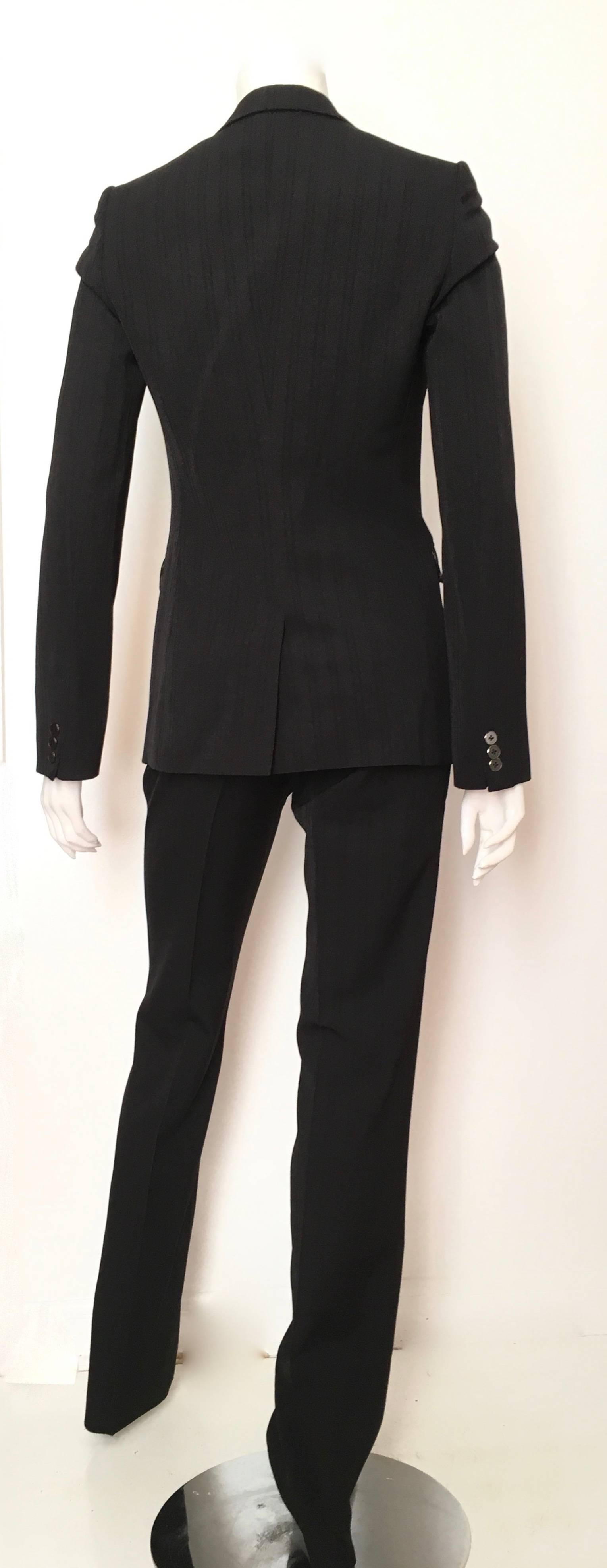 Dolce & Gabbana Black Striped Wool Pant Suit with Cheetah lining Size 4. In Excellent Condition For Sale In Atlanta, GA