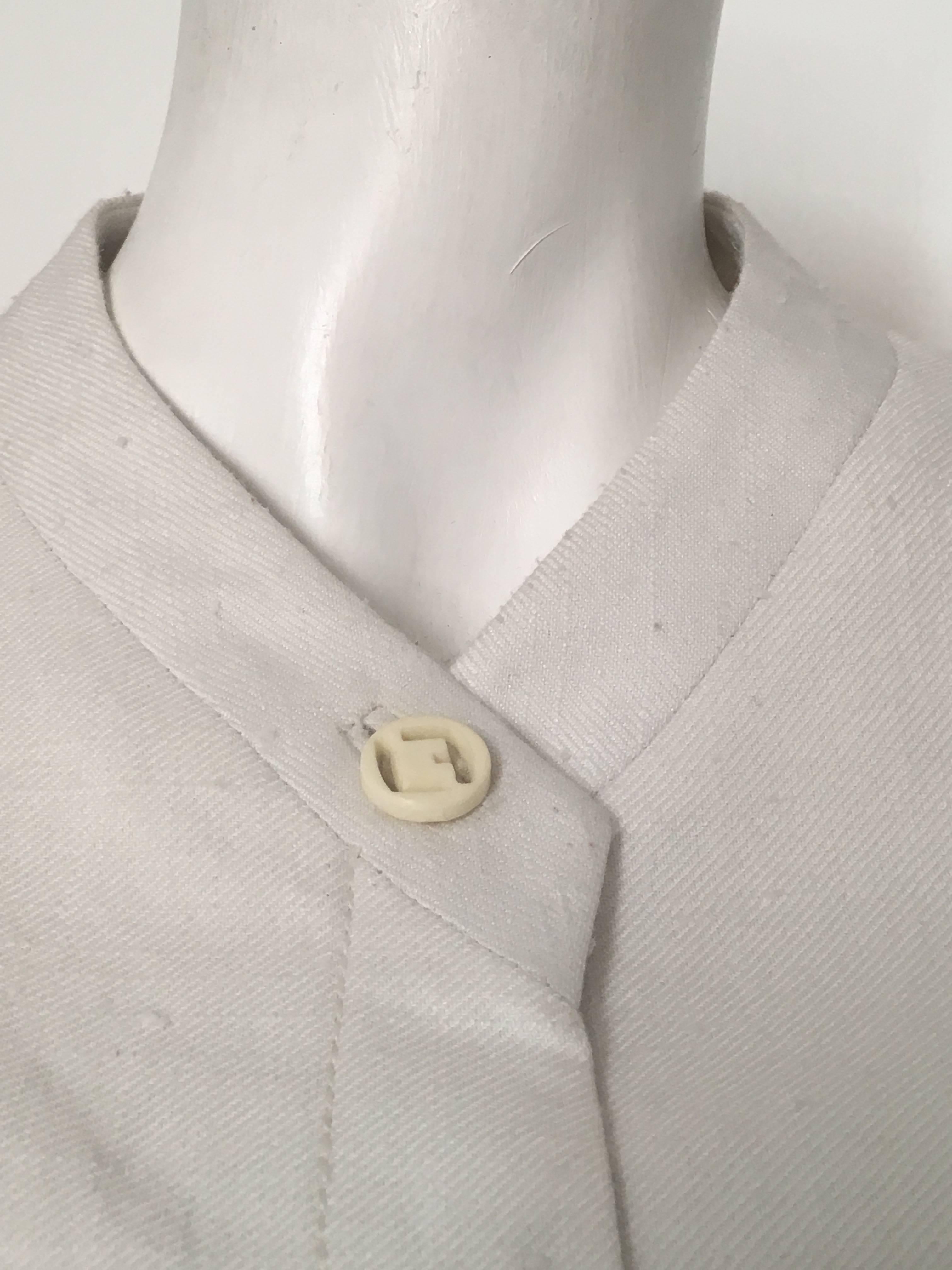 Louis Feraud Paris by Andre Peters 1970s very bright white nubby silk cropped jacket will fit an USA size 6.  Ladies please grab your tape measure so you can measure your bust, waist & sleeve length to make certain this gorgeous cropped jacket will