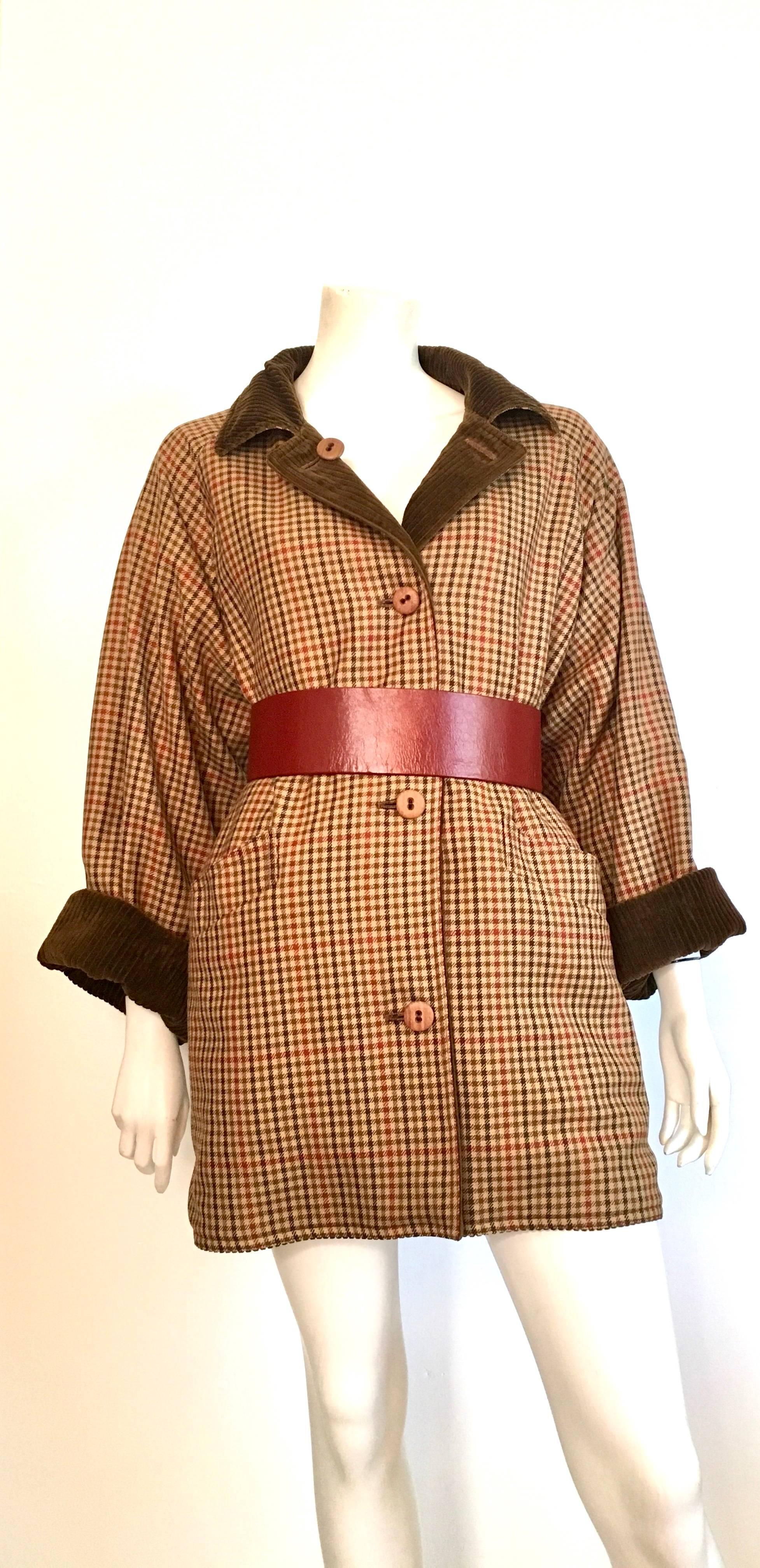 Bill Blass for Neiman Marcus 1970s reversible plaid & corduroy coat / dress with pockets is a size 12.  Gorgeous plaid pattern on one side and on the other side is brown corduroy fabric.  This coat has wooden buttons and 2 front pockets on both