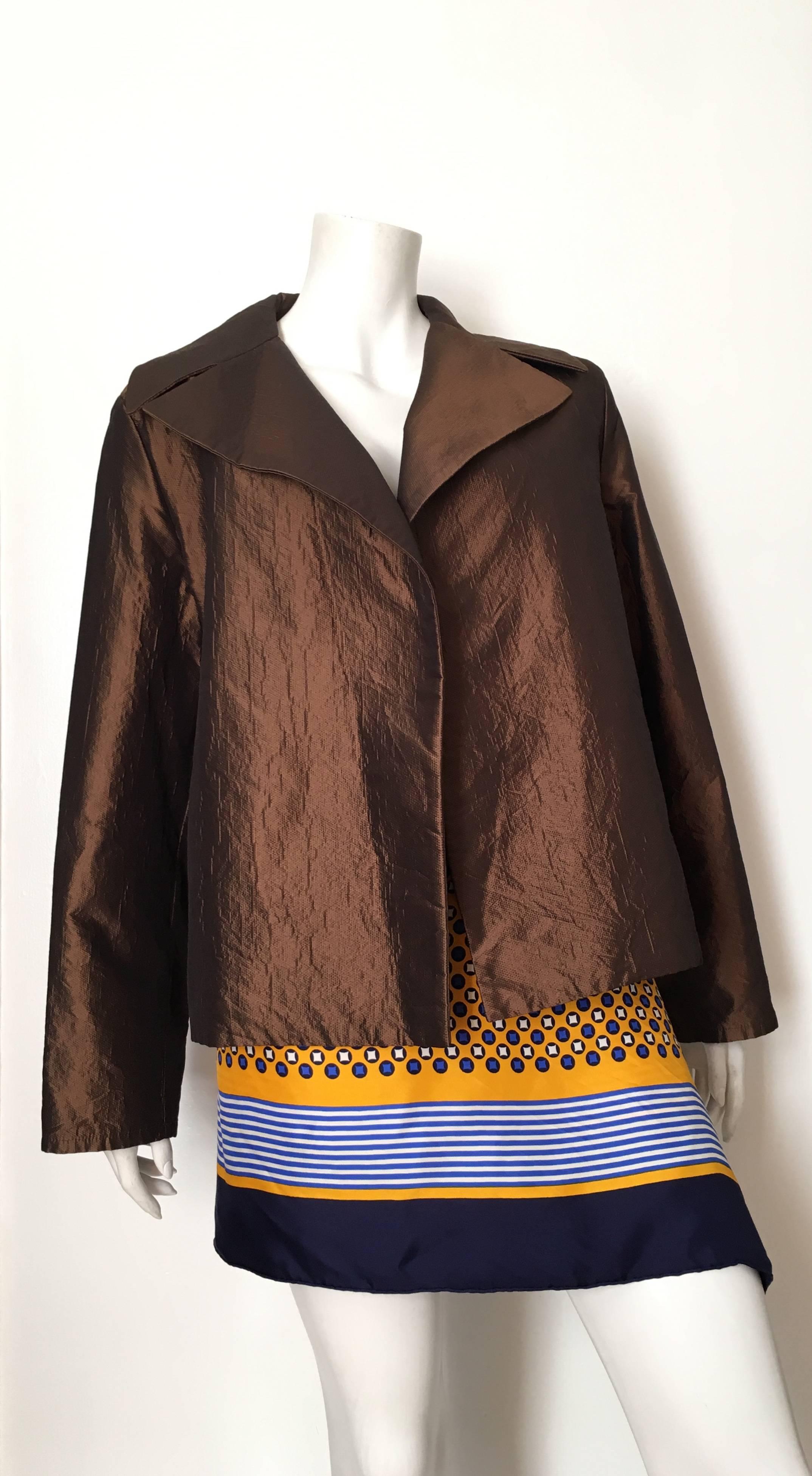 Dusan bronze silk & cashmere blend jacket is a size x-large. Belted or worn open this bronze jacket is stunning.  The retail price of this jacket was $2,000 when it was purchased and it's in excellent pristine condition. 
Measurements are:
49