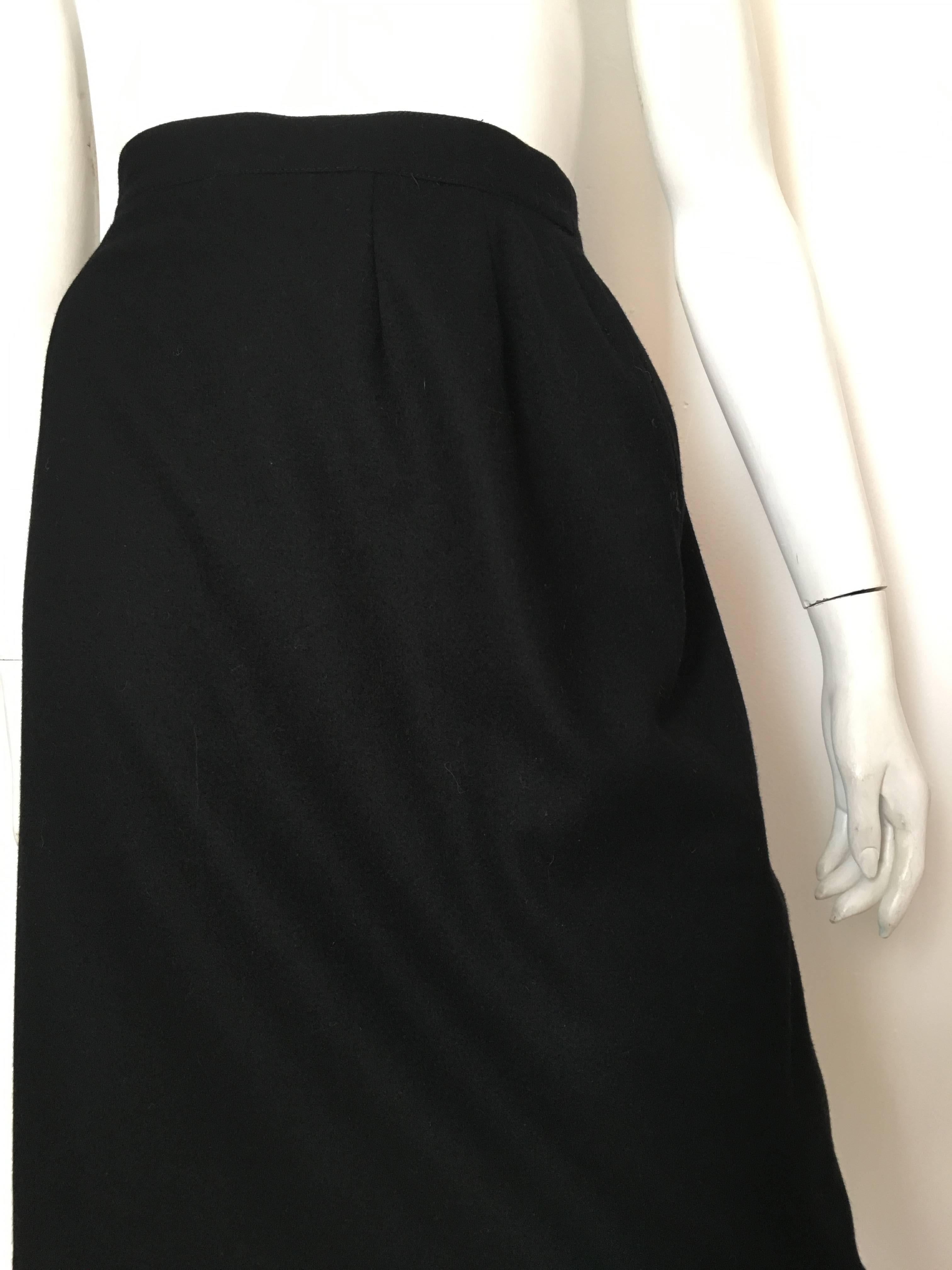 Karl Lagerfeld for Neiman Marcus 1980s black wool cashmere blend pencil skirt is a French size 38 and fits an USA size 6. Ladies please grab your tape measure so you can properly measure your waist, hips and length to see if this vintage treasure