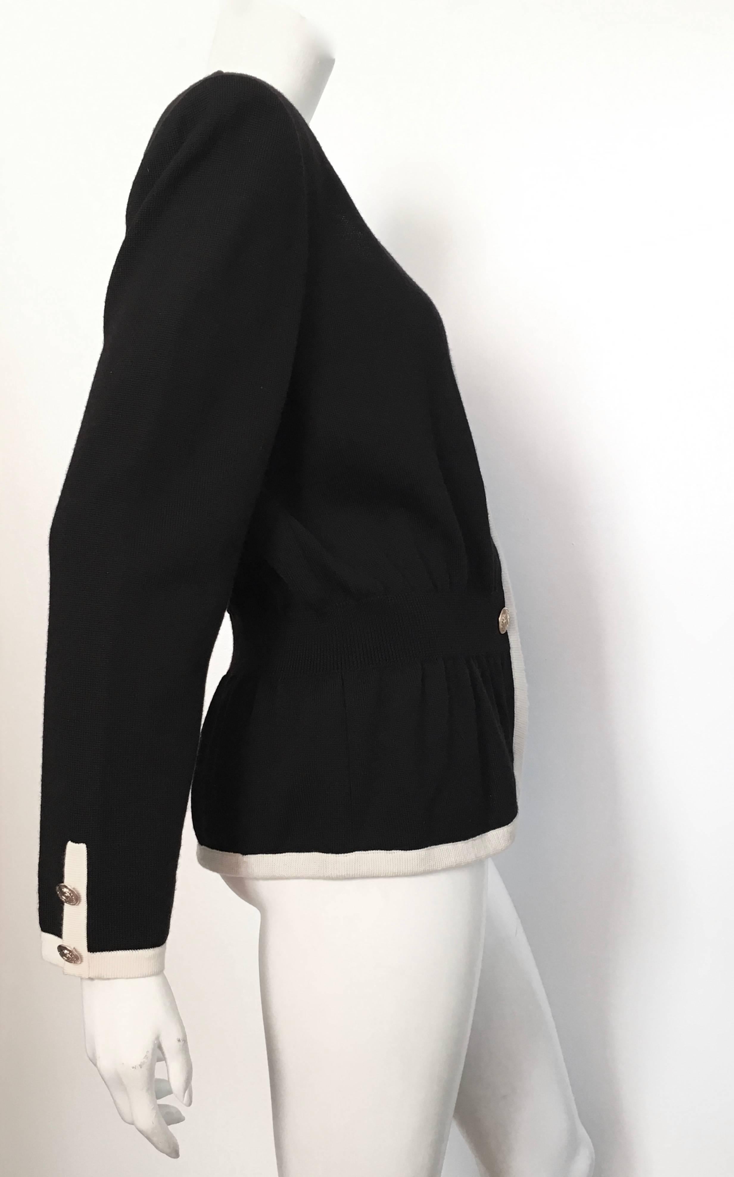 Valentino Black Wool Knit Cardigan with Gold V Buttons Size 10 / 12.  In Excellent Condition For Sale In Atlanta, GA