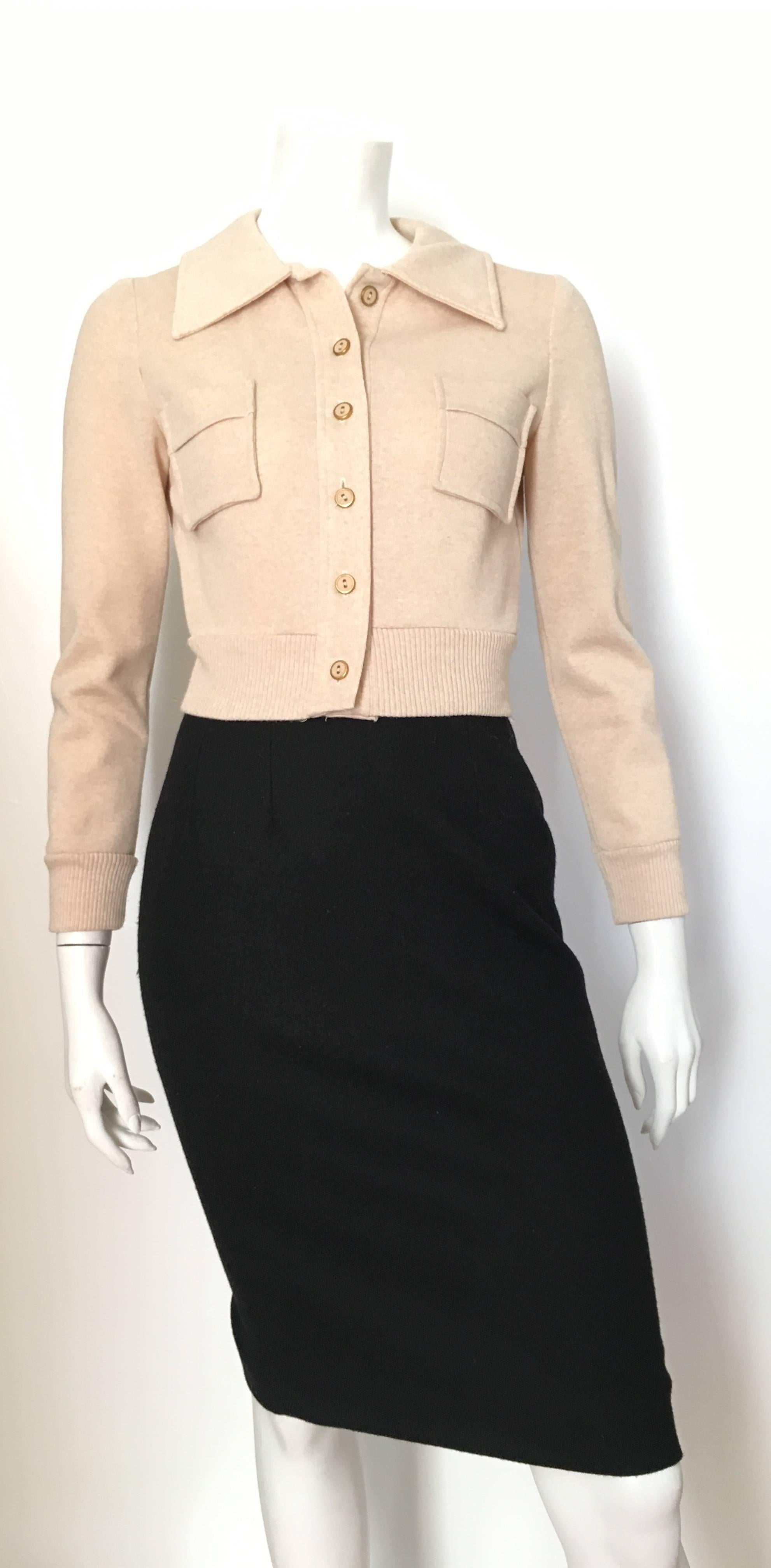 Neiman Marcus 1960s tan cropped knit jacket is a size 4. If your body type is like Matilda the Mannequin then this is for you...  This  can be a sporty look or a dressy look, either way this knit cropped jacket is divine. 
Measurements are:
35