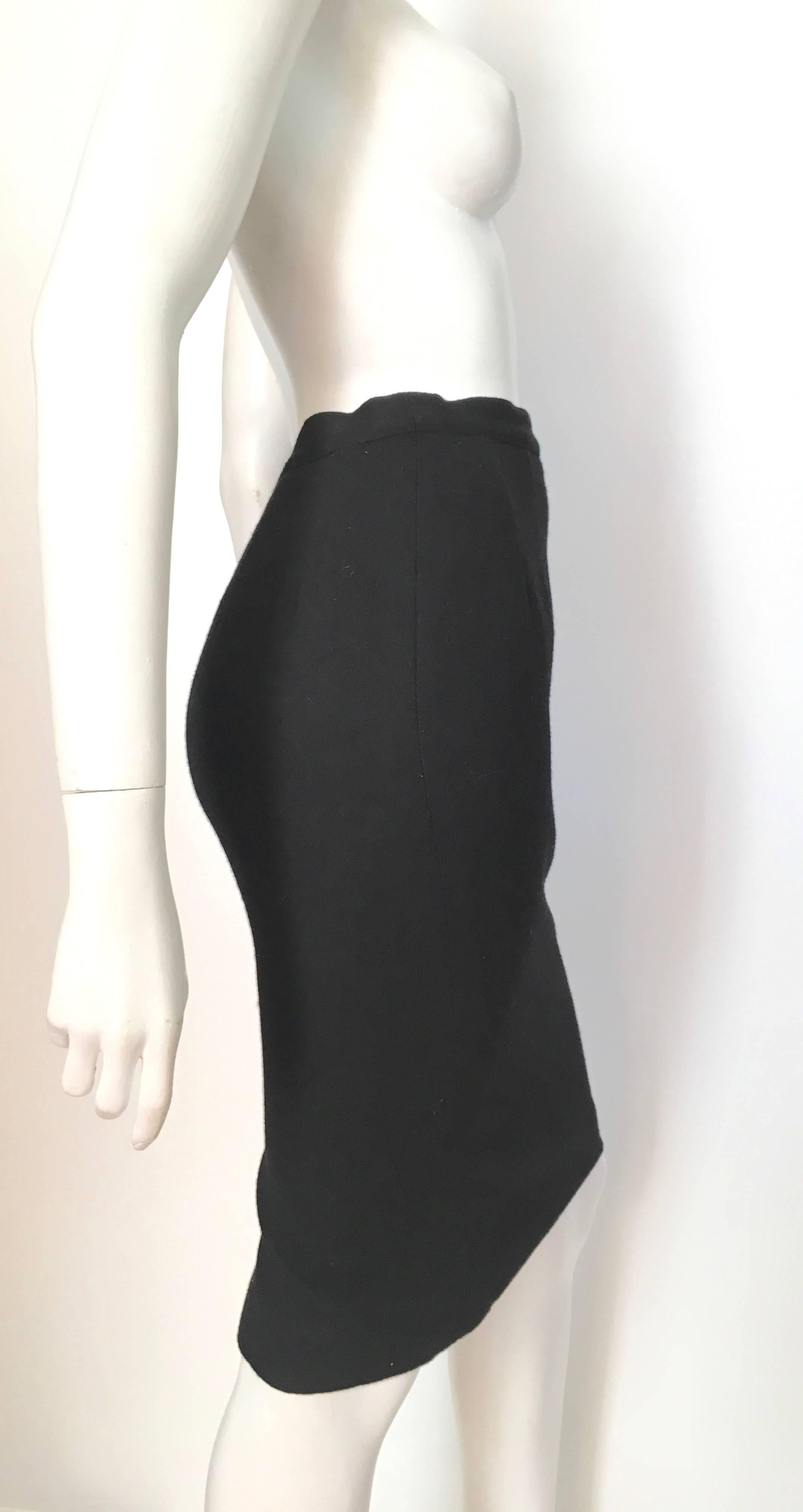Guy Laroche black wool pencil skirt is a size 4. Ladies please grab your handy tape measure so you can measure your waist, hips & length to make sure this treasure will fit your lovely body.  Classic & timeless design and exquisite craftsmanship