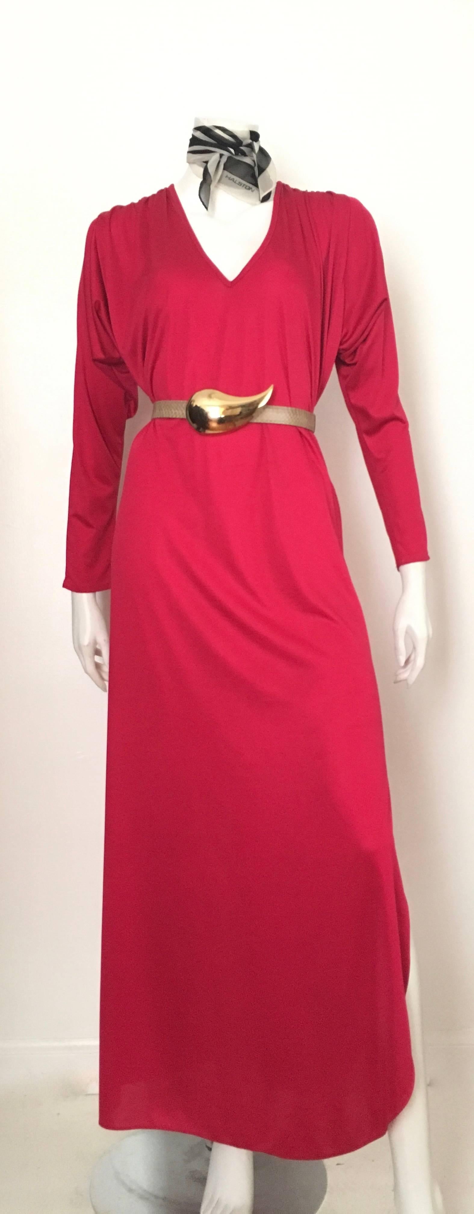 Gorgeous 1980s sexy evening dress / gown by Swirl will fit a size 6. Flowing design that can easily be belted as shown in photo. Dolman sleeves with ruching at the shoulders.  Sexy slit up side of dress.  Dress is not lined. Oscar de la Renta &