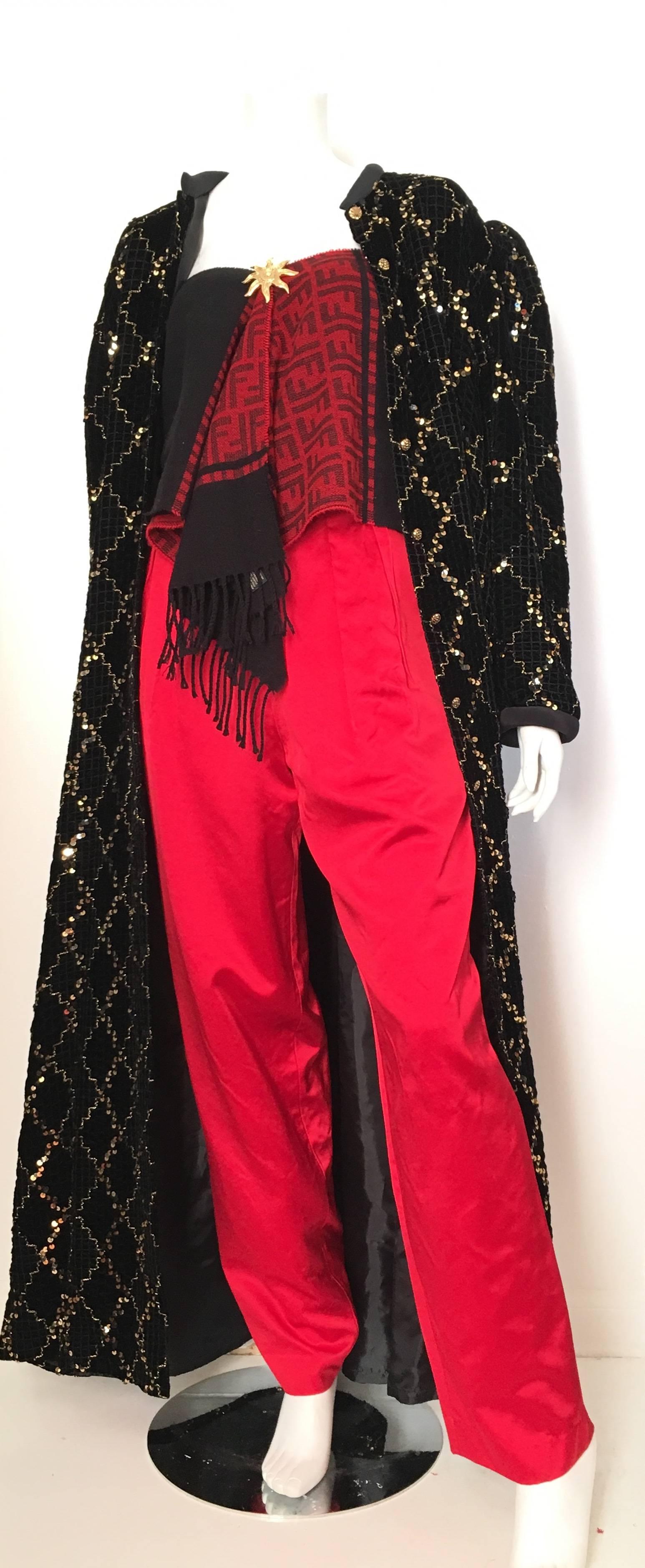 David Brown for Neiman Marcus 1980s black velvet with gold & black sequin evening button up coat is a size large and will fit an USA size 10/12.  This stunning David Brown black velvet evening coat can be worn as a dress, so your options are