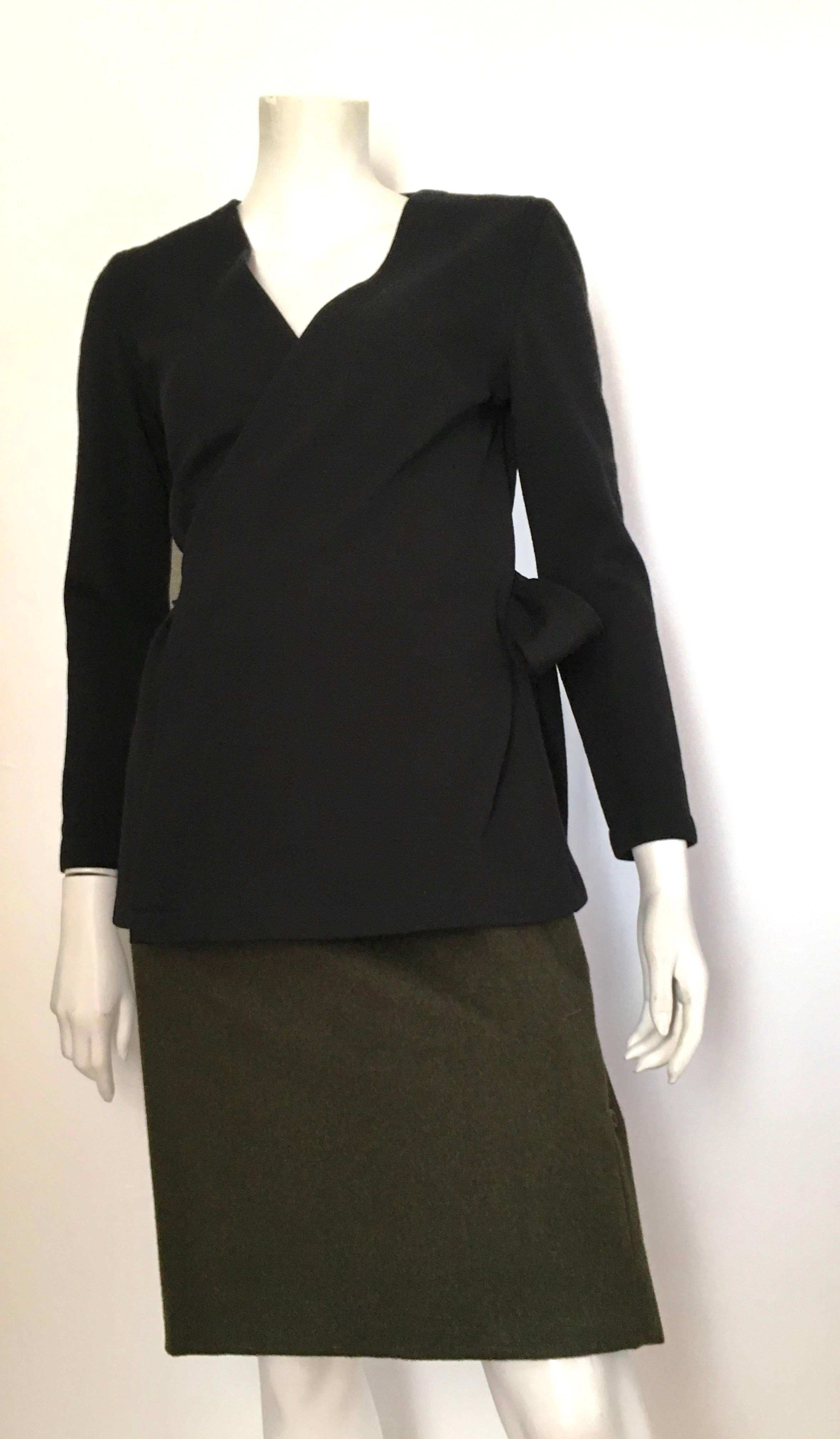Tom and Linda Platt for Saks Fifth Avenue 1980s black wool wrap jacket is a size petite. Knit wool fabric. Not lined. Wear this black wrap jacket with your vintage Calvin Klein jeans or your classic Chanel pants and watch the paparazzi go mad. 