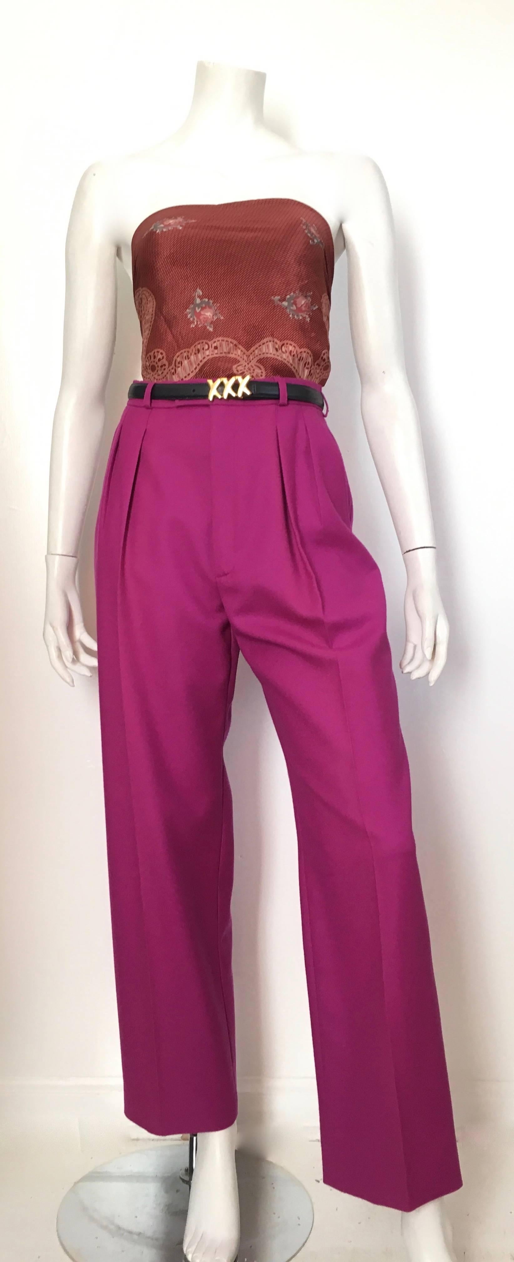 Saint Laurent Rive Gauche 1980s purple wool pleated pants with pockets is a French size 40 and fits like an USA size 4.  Ladies please grab your tape measure so you can measure your waist & hips to make certain this vintage treasure will fit your