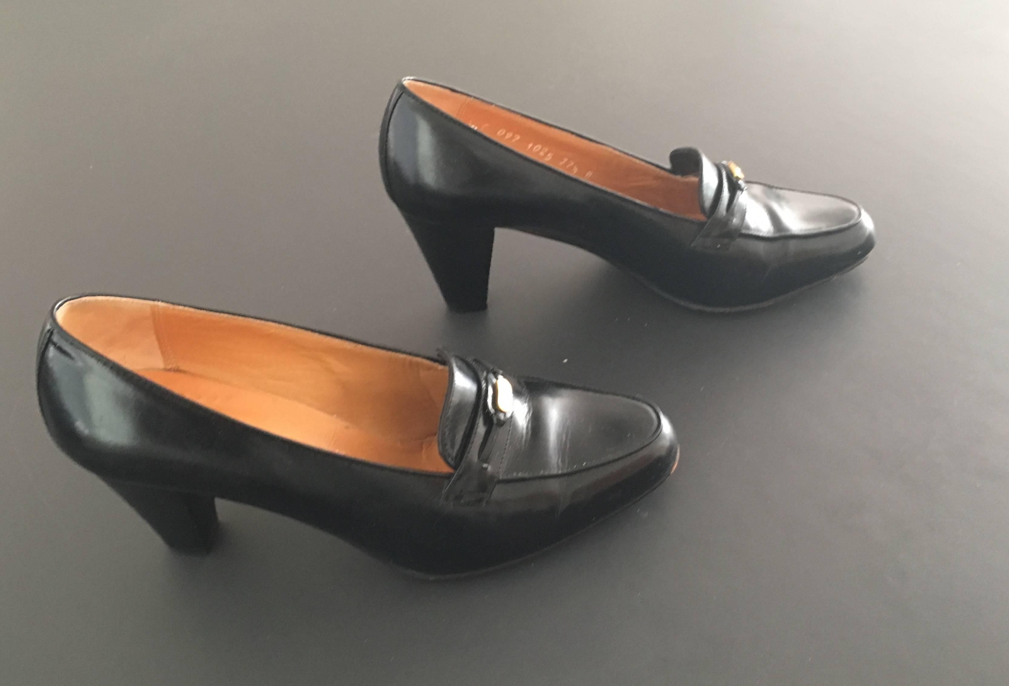 Gucci 1970s black leather heeled loafers is marked 37.1/2 B and fits an USA women's size 7. The woman who consigned these shoes wears a size 7 and these fit her perfectly.  Wear these classic Gucci loafers with jeans, pants, skirts or suits.