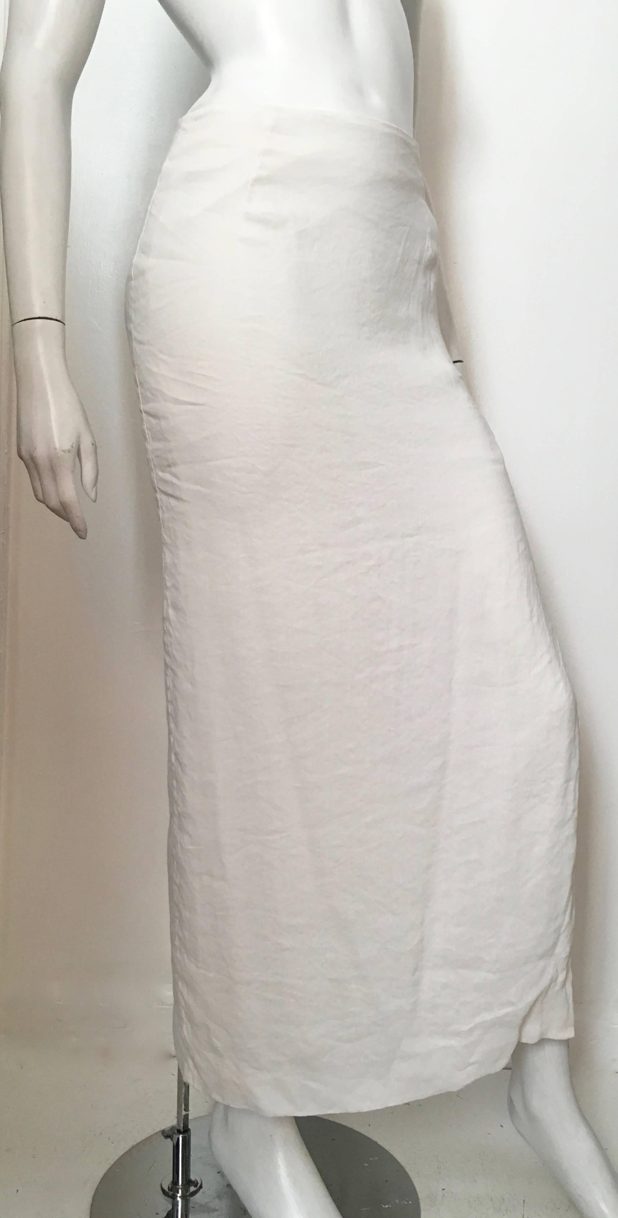 Gianfranco Ferre Studio maxi white linen skirt is labeled size 8 but fits like a modern USA size 6.  Ladies please grab your tape measure so you can measure your waist & hips to make certain this piece will fit your lovely body. Sexy slit on