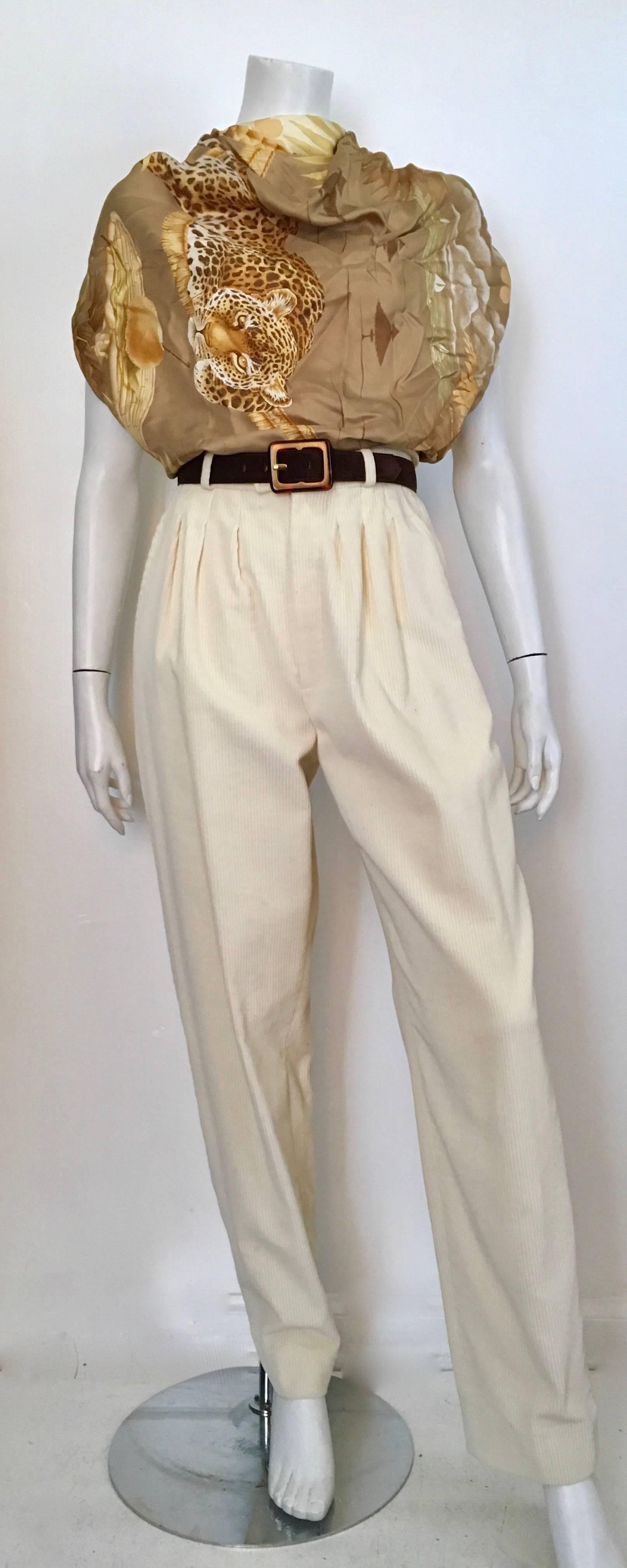 Yves Saint Laurent Rive Gauche 1980s cream corduroy pleated pants with pockets size 4. Classic & timeless YSL pleated pants with many more miles to go.  These pants are just as wearable today as the day they were produced. Wear these corduroy pants