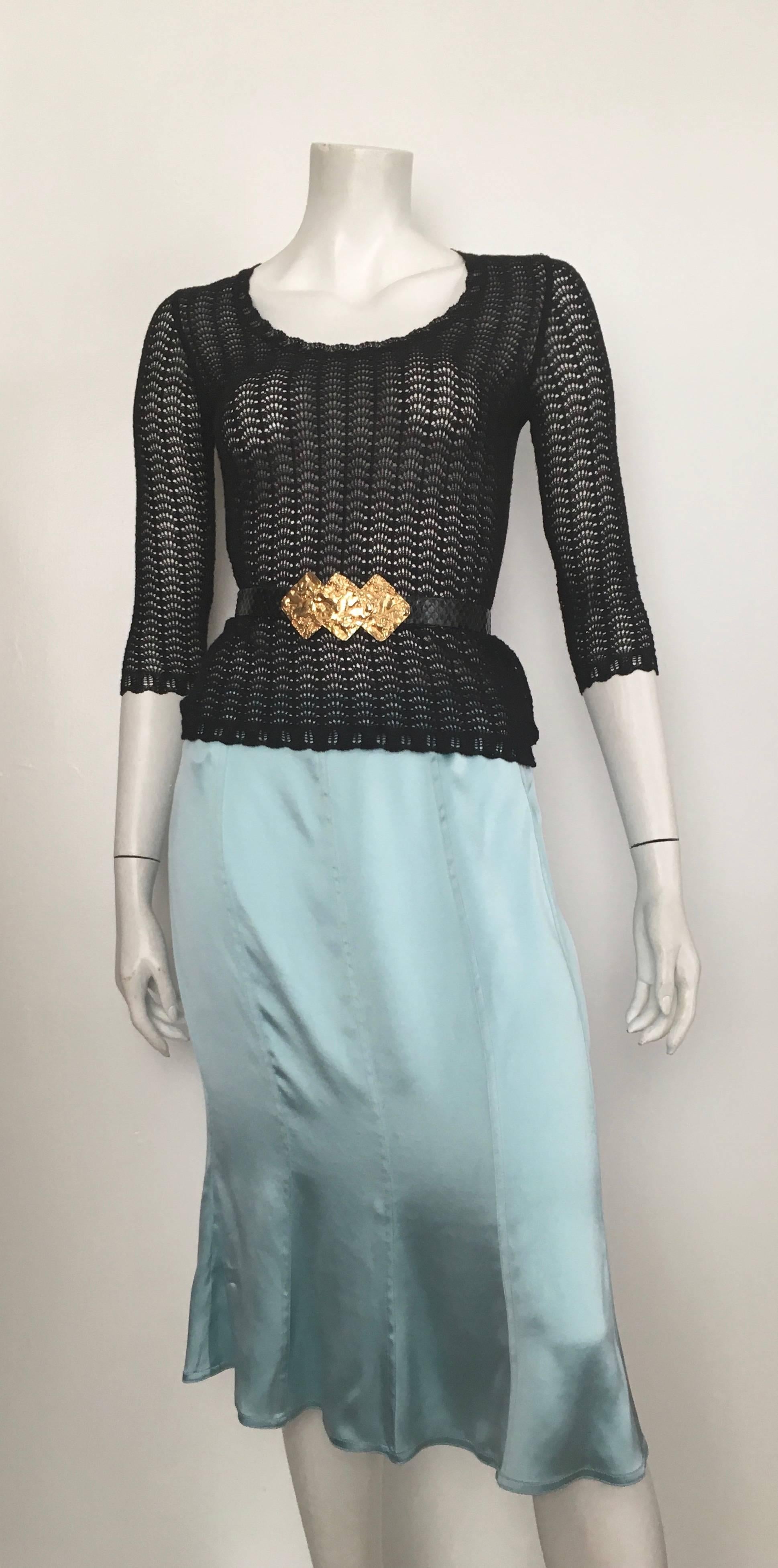 Yves Saint Laurent Rive Gauche by Tom Ford Fall 2003 aqua silk skirt is a French size 42 and fits an USA size 10.  Ladies please grab your trusted friend, Mr. Tape Measure, so you can properly measure your waist & hips to make certain this will fit