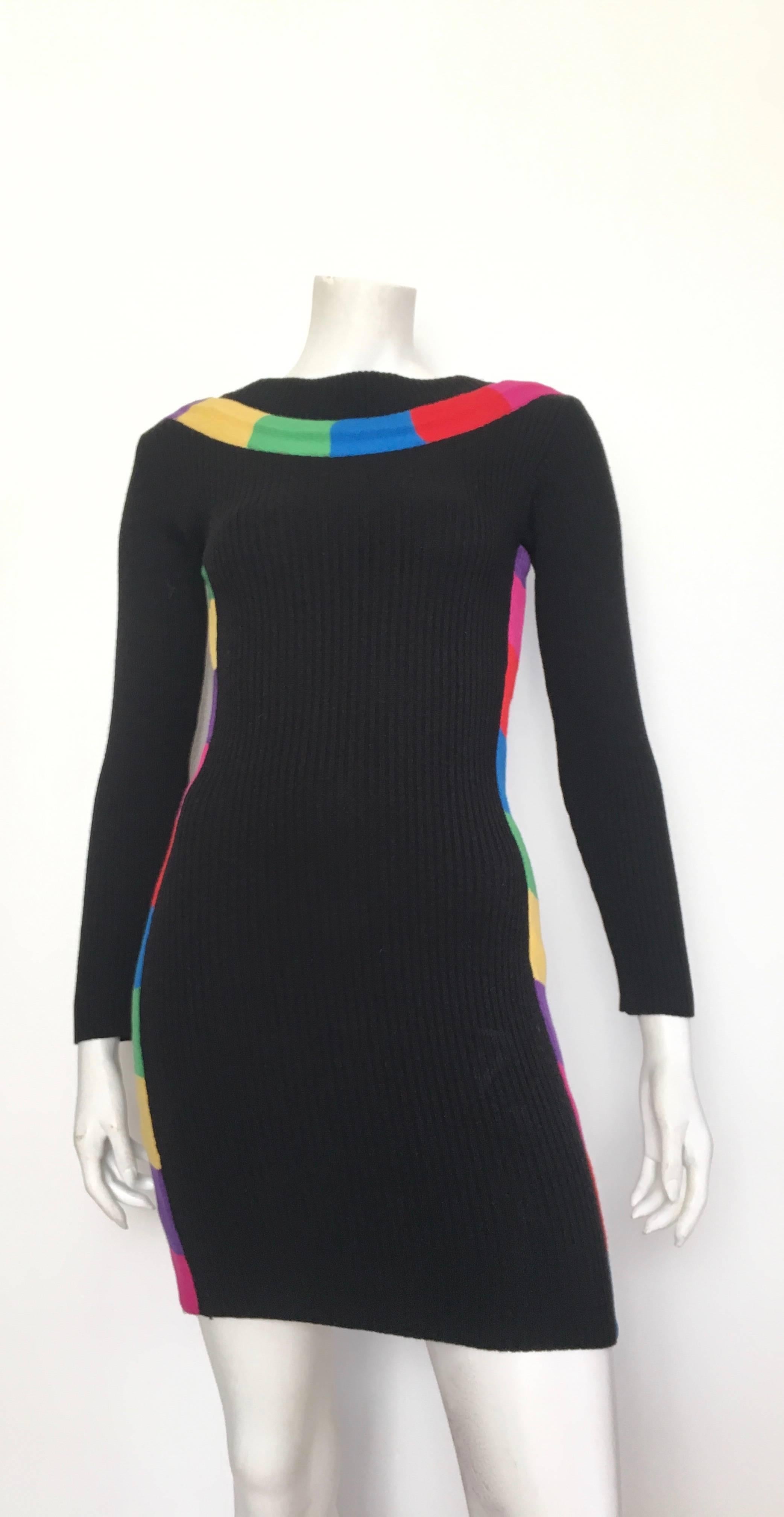 Patrick Kelly Paris late 1980s black wool knit 'rainbow' sexy mini dress will fit an USA size 4. If you have the body type of Matilda the Mannequin, which is a size 4, then this gorgeous rare dress is for you.  Patrick Kelly gave this to model and