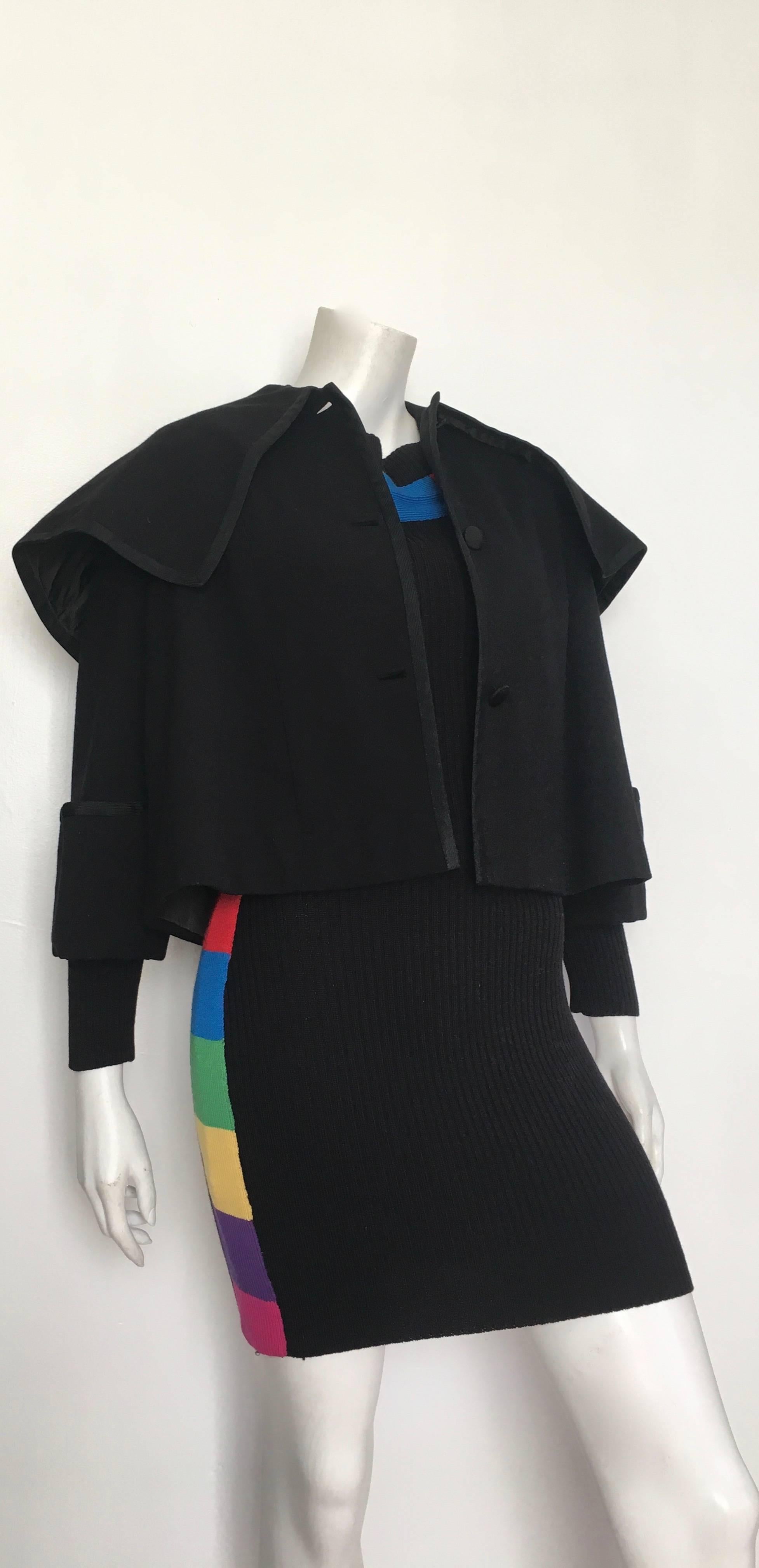 Traina-Norell 1950s black wool cropped 3 button capelet jacket will fit an USA size 6/8.  Jacket was from Leon Frohsin who was the owner of a fine fur shop in Atlanta. Every detail about this Traina Norell capelet is exquisite.  This is a very fine