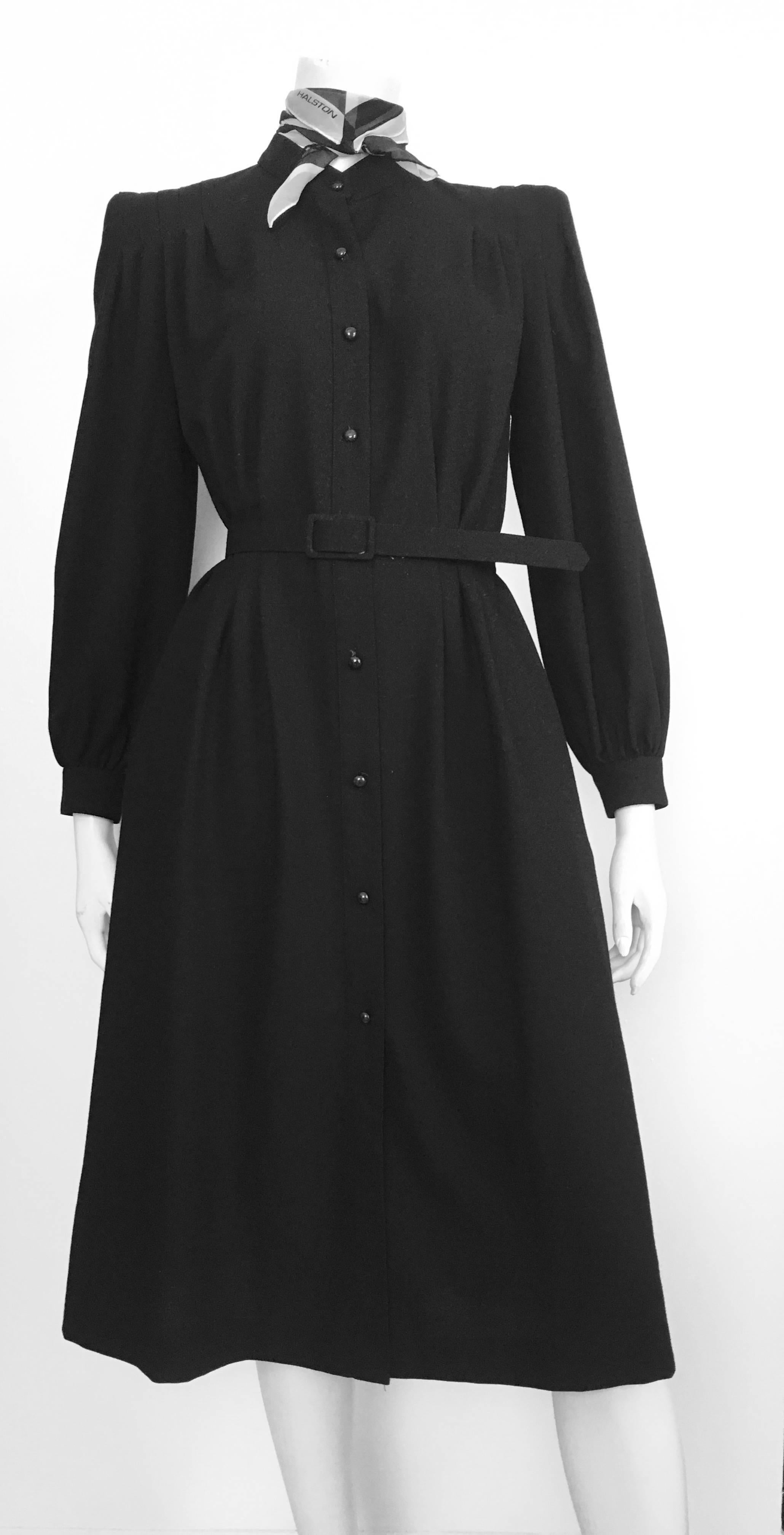Pierre Cardin 1980s black wool button up dress with pockets & belt is labeled a size 10 but fits like a modern 6/8. The waist is 30.1/2