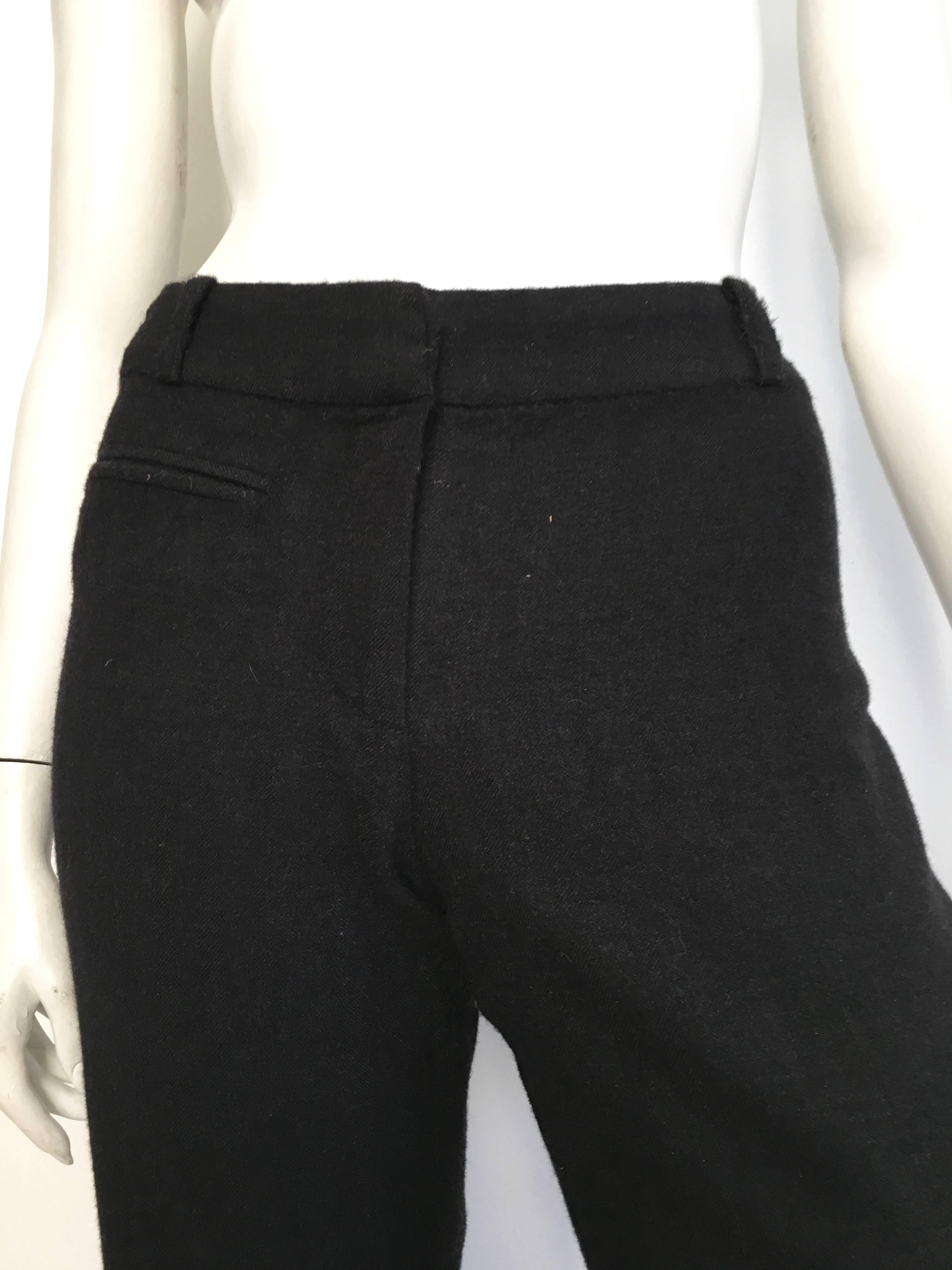 Christian Dior Boutique black wool pants are a size 4.  These fit Matilda the Mannequin snuggly so if your body type is that of Matilda then it's a green light.  The pockets are faux and these pants are silk lined. Please pay attention to the length