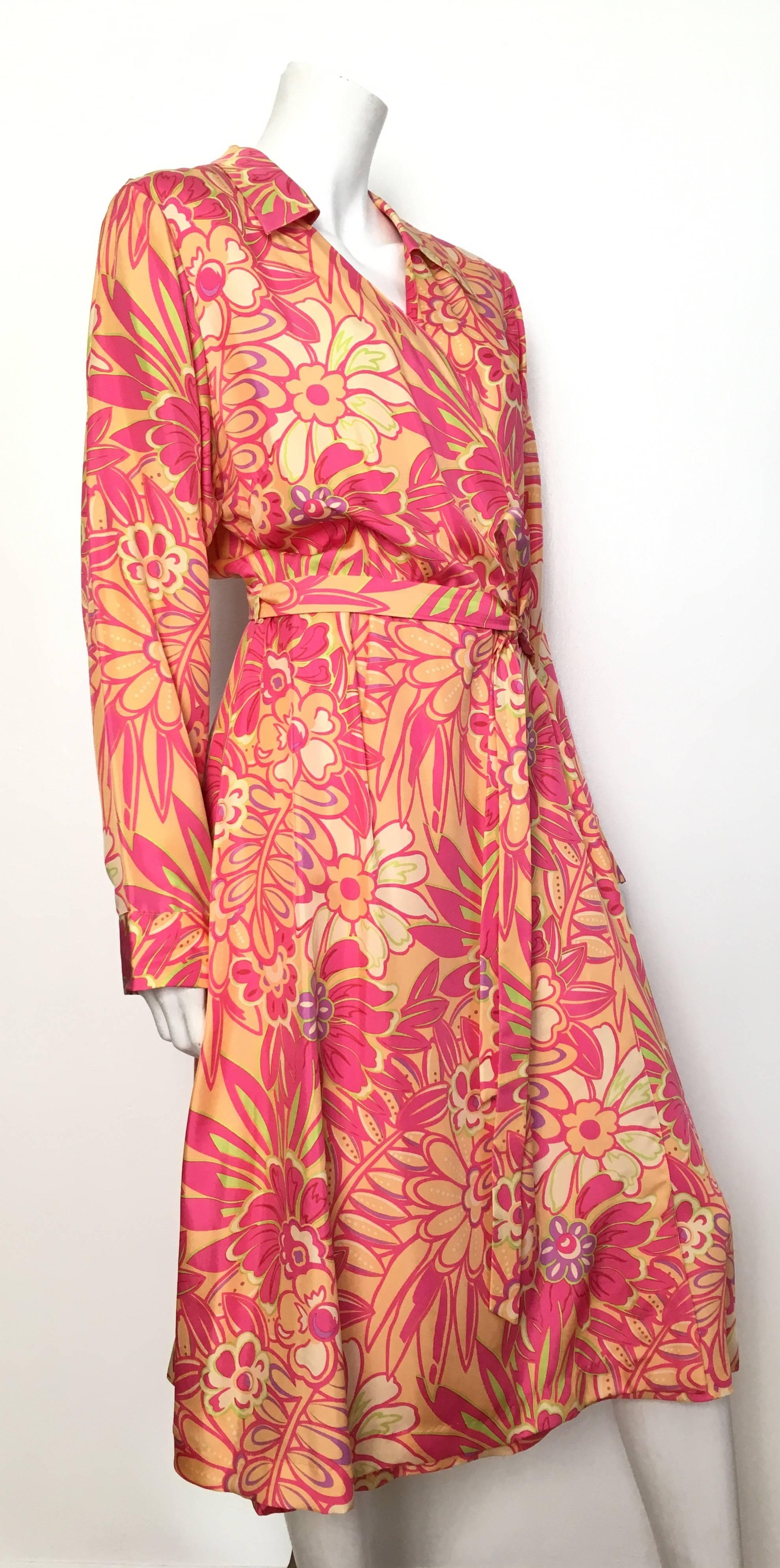 Bob Mackie Studio 1980s floral silk wrap dress is a size large and fits a size 14 / 16. Ladies please grab your most trusted friend, Mr. Tape Measure, so you can measure you bust, waist & hips to make certain this gorgeous wrap dress will fit
