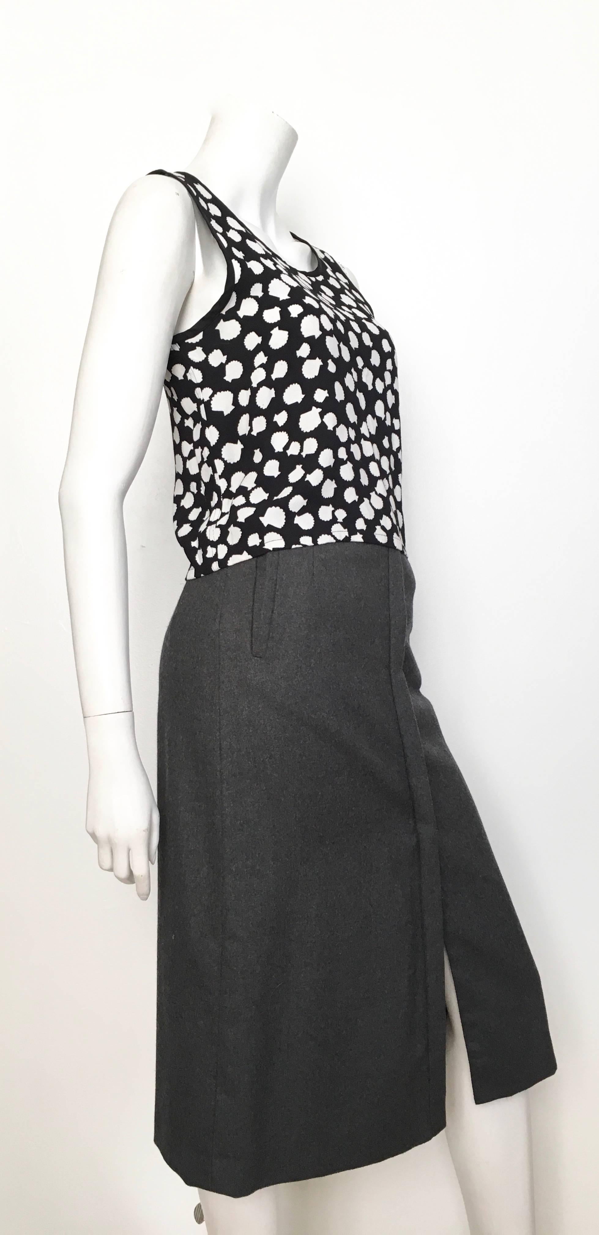 Giorgio Saint' Angelo 1980s grey wool straight skirt is labeled a size 6 but fits like a modern size 4.  Ladies please grab your tape measure and measure your waist & hips to make certain this timeless skirt will fit your lovely body.  Skirt is