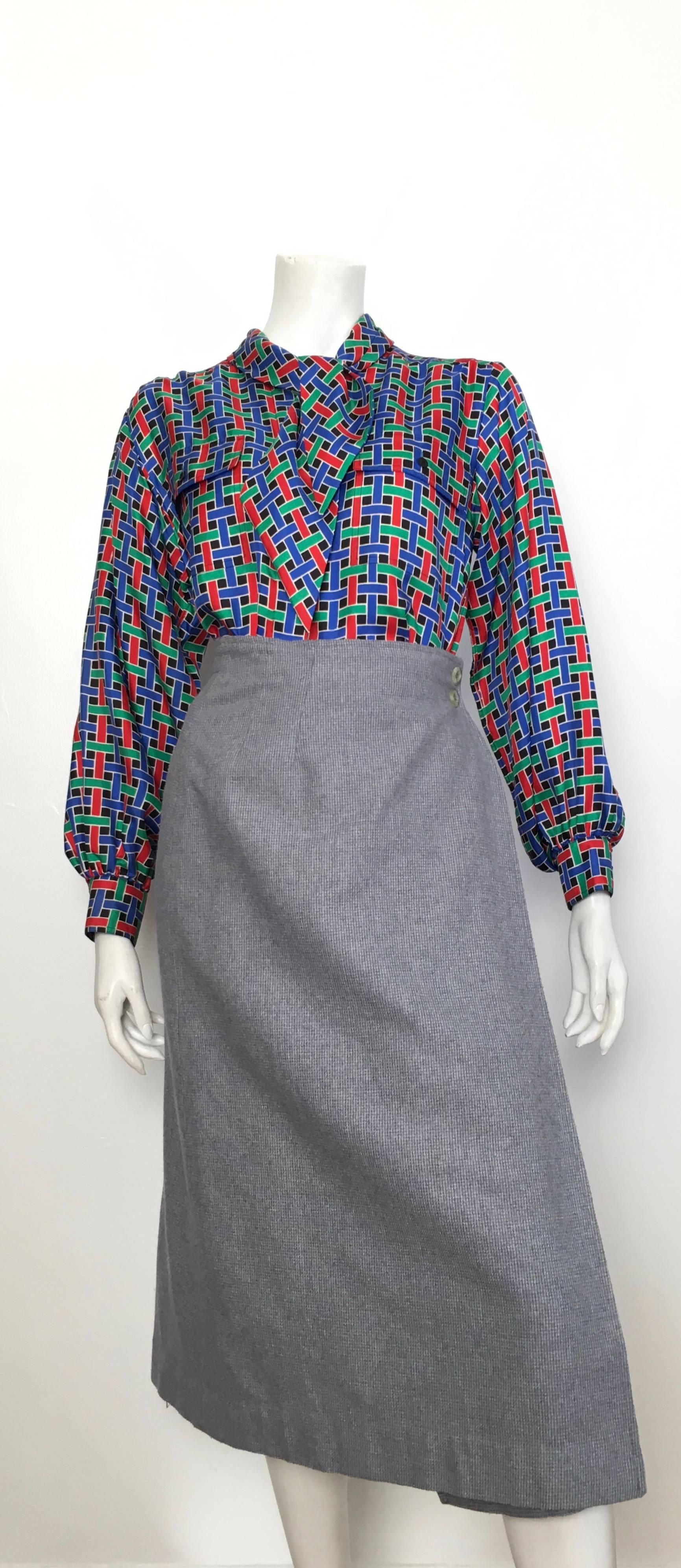 Saint Laurent Rive Gauche 1980s red, blue & green woven pattern blouse is a French size 38 and fits like a size 6 / 8.  This blouse was designed to be big & blousy so it is supposed to fit loose & flowing. This piece was purchased by my client at