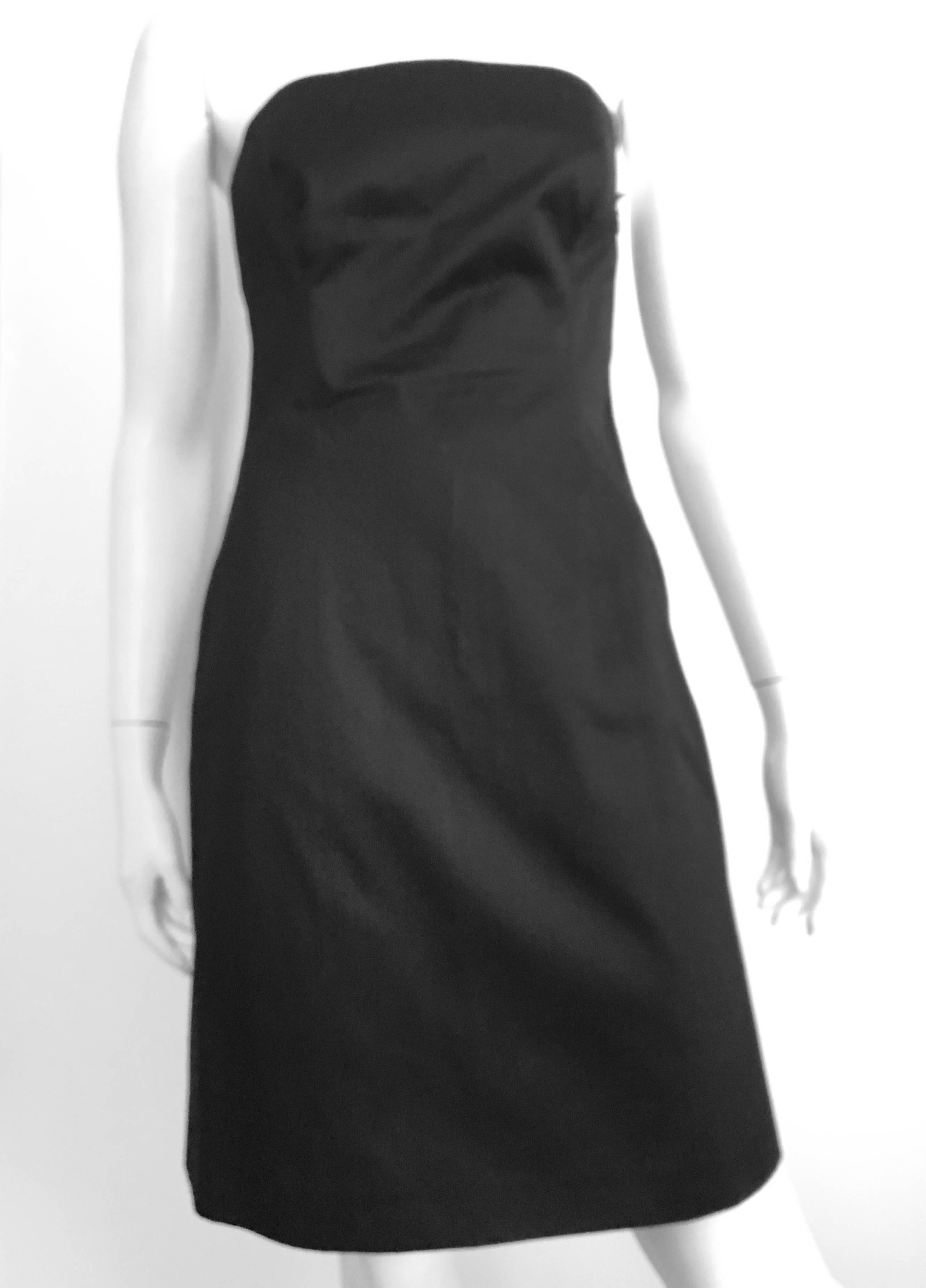 Kors by Michael Kors strapless cotton black evening cocktail dress is labeled a size 4 but fits more like a size 6. The waist on this piece is 29.1/2" it is borderline between size 4 & 6.  Ladies if you are a size 4 please grab your tape
