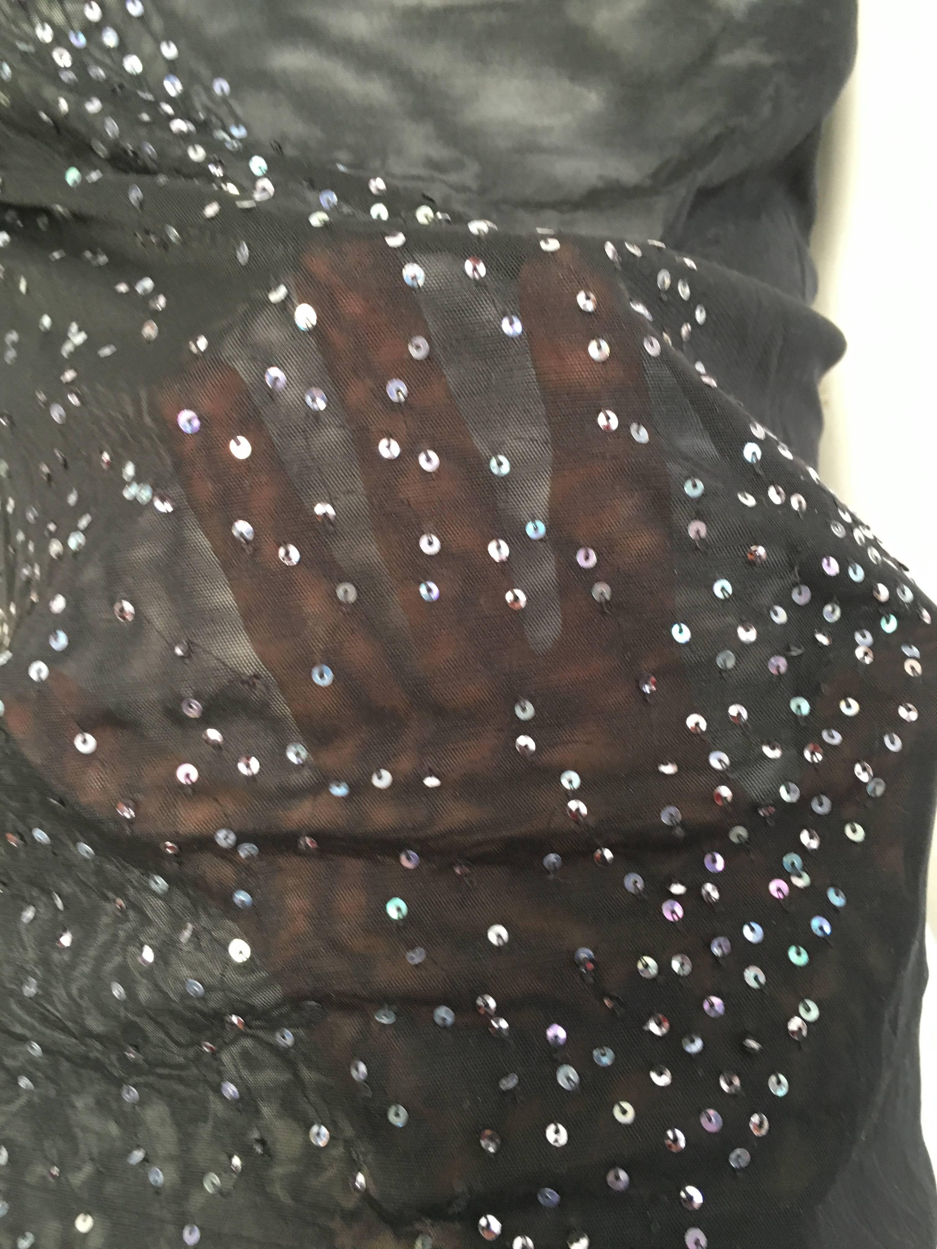 Narciso Rodriguez black sheer sleeveless sequin top is a size 6.  This sexy & contemporary sheer top is jaw dropping and would be perfect for any red carpet event. Why buy trends when the classics are so much better? 
Measurements are:
35