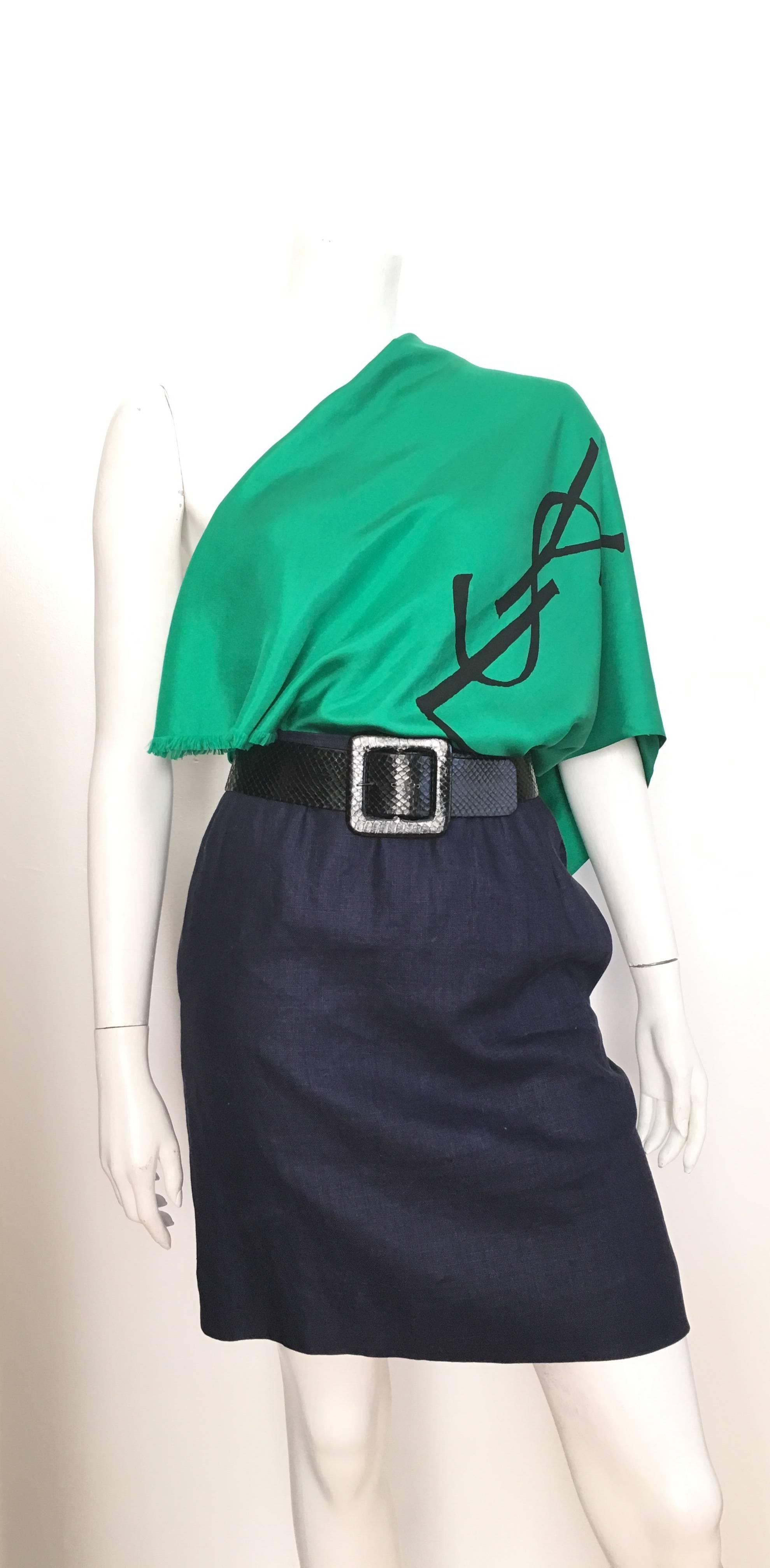 Yves Saint Laurent for Saint Laurent Rive Gauche 1980s navy linen pencil skirt with pockets is a French size 38 and fits an USA size 4.  The waist on this skirt is 25.3/4