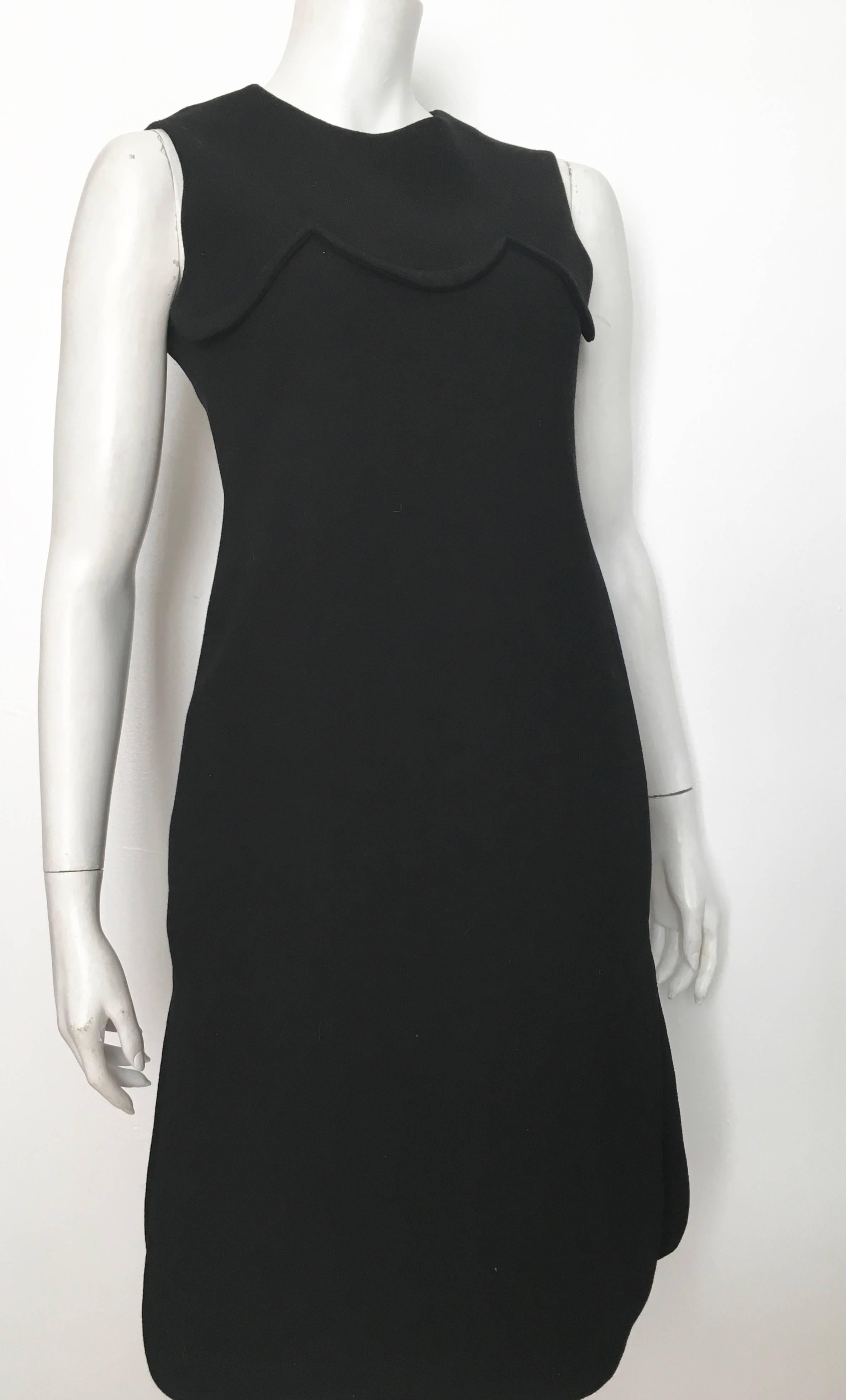 Pierre Cardin for Saks Fifth Avenue 1971 black thick wool sleeveless dress will fit a size 6.  Ladies please grab that amazing tape measure and measure your bust line, waist & hips to make certain this true vintage gem will fit your lovely body.