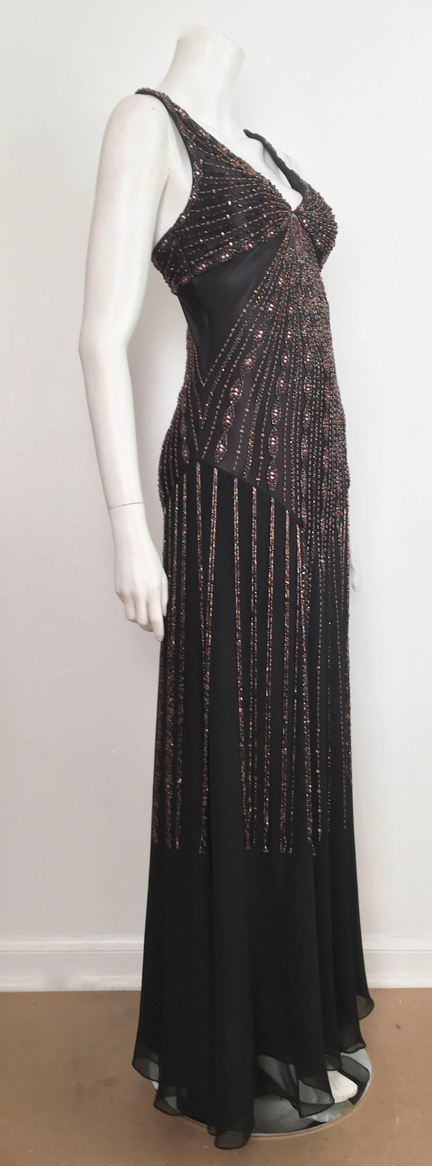 Sue Wong black silk beaded sleeveless evening maxi bias cut dress is a size 2. This magnificent and most elegant sexy maxi dress is a real eye catcher. Zipper on the side and dress is lined. Wear your Dior heels and go dance the night
