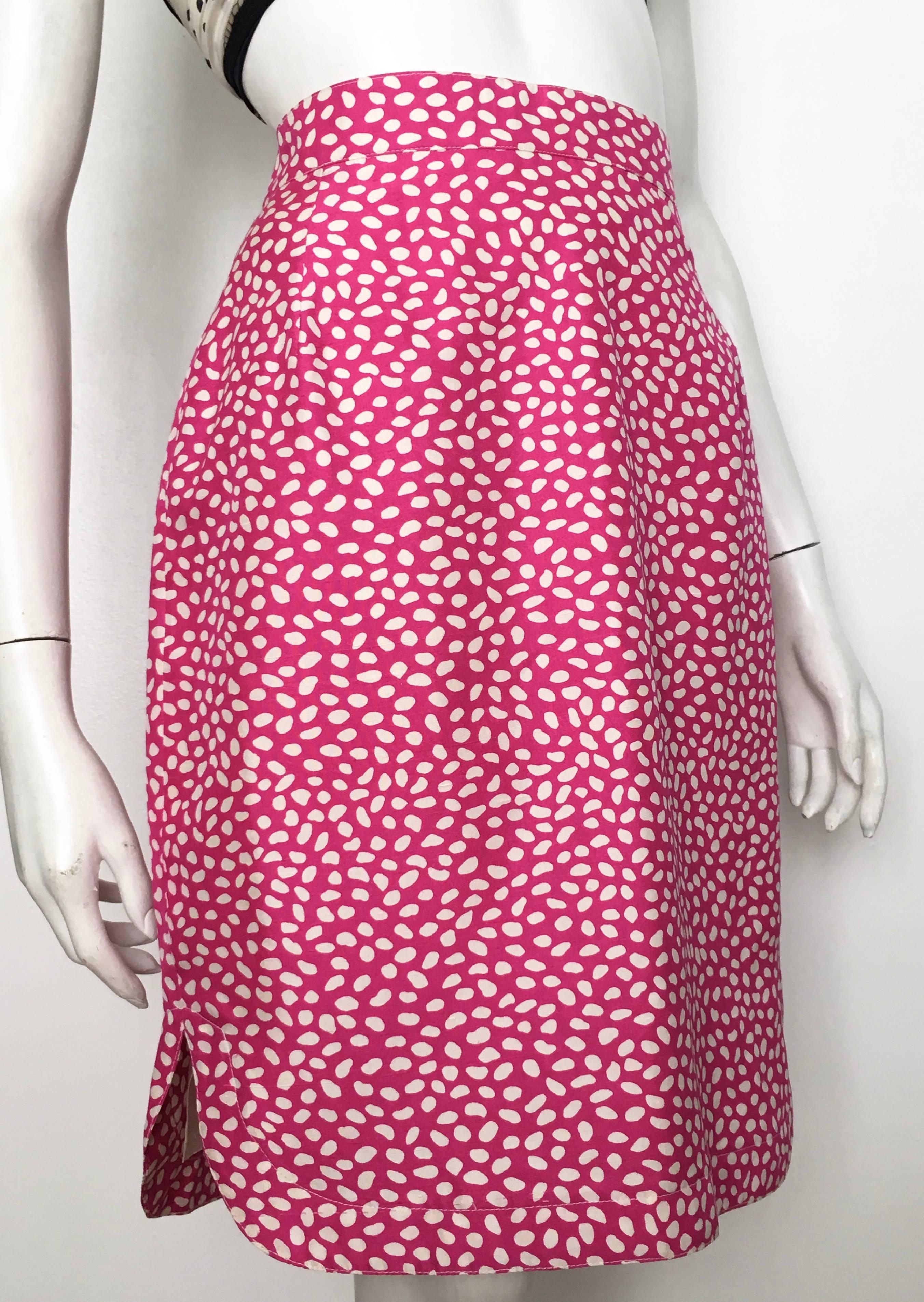 Louis Feraud 1980s pink cotton with abstract design straight skirt is marked a size 8 but fits more like a size 6.  The waist on this skirt is 29. 1/2