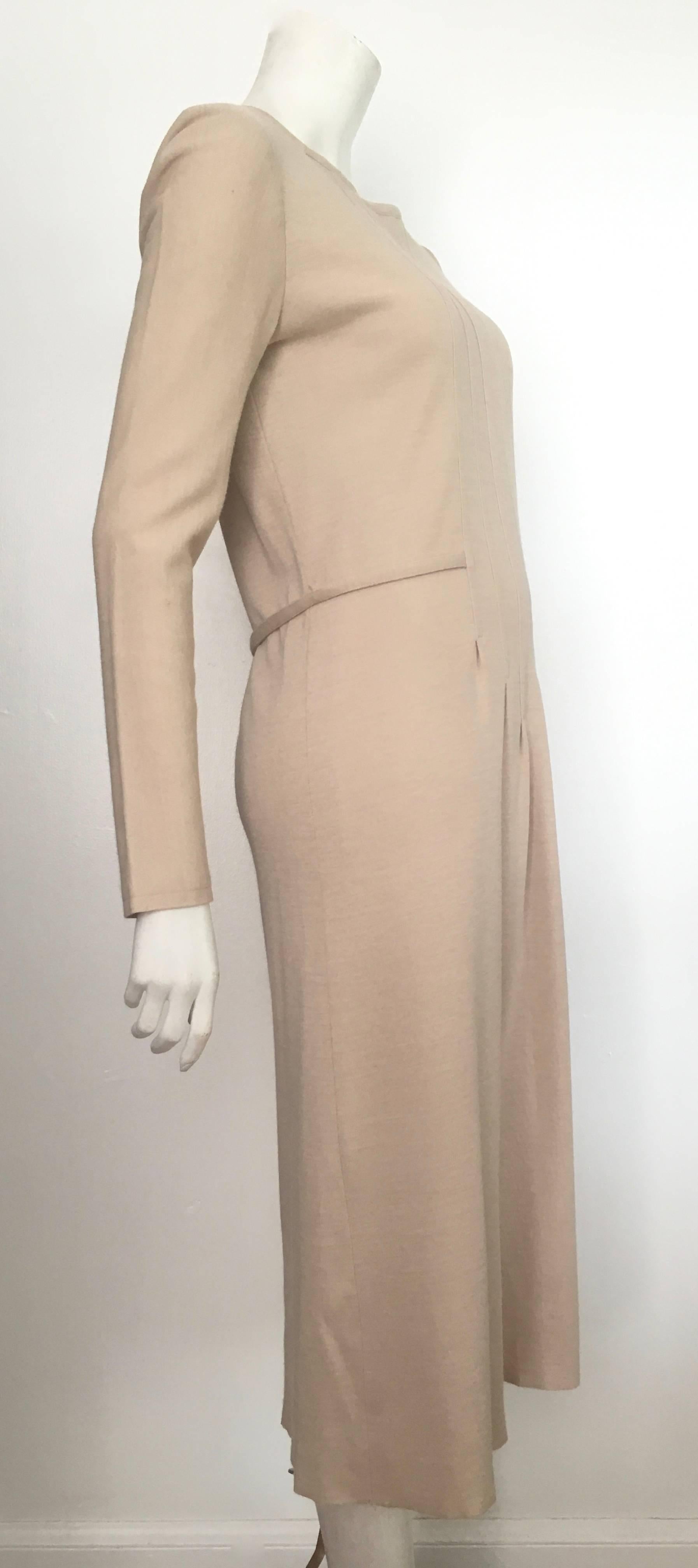 Geoffrey Beene Boutique 1970s wool knit tan long sleeve dress will fit a size 8.  The waist on this dress is 34