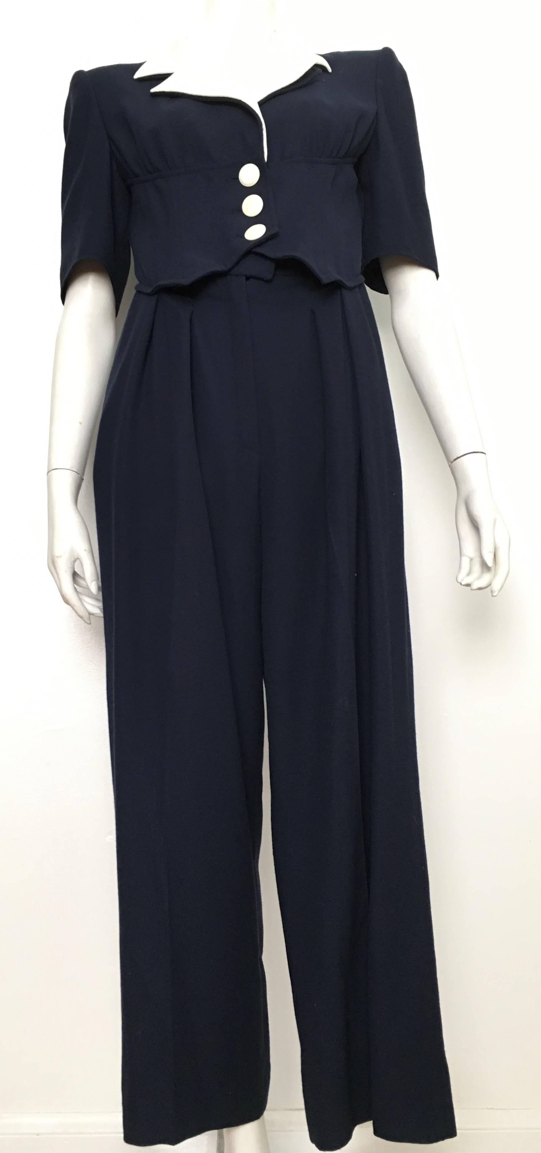 Valentino Boutique 1980s navy wool jumpsuit with pockets has white cotton collar trim is labeled a size 10 but fits like a size 6.  The waist is 28.1/2