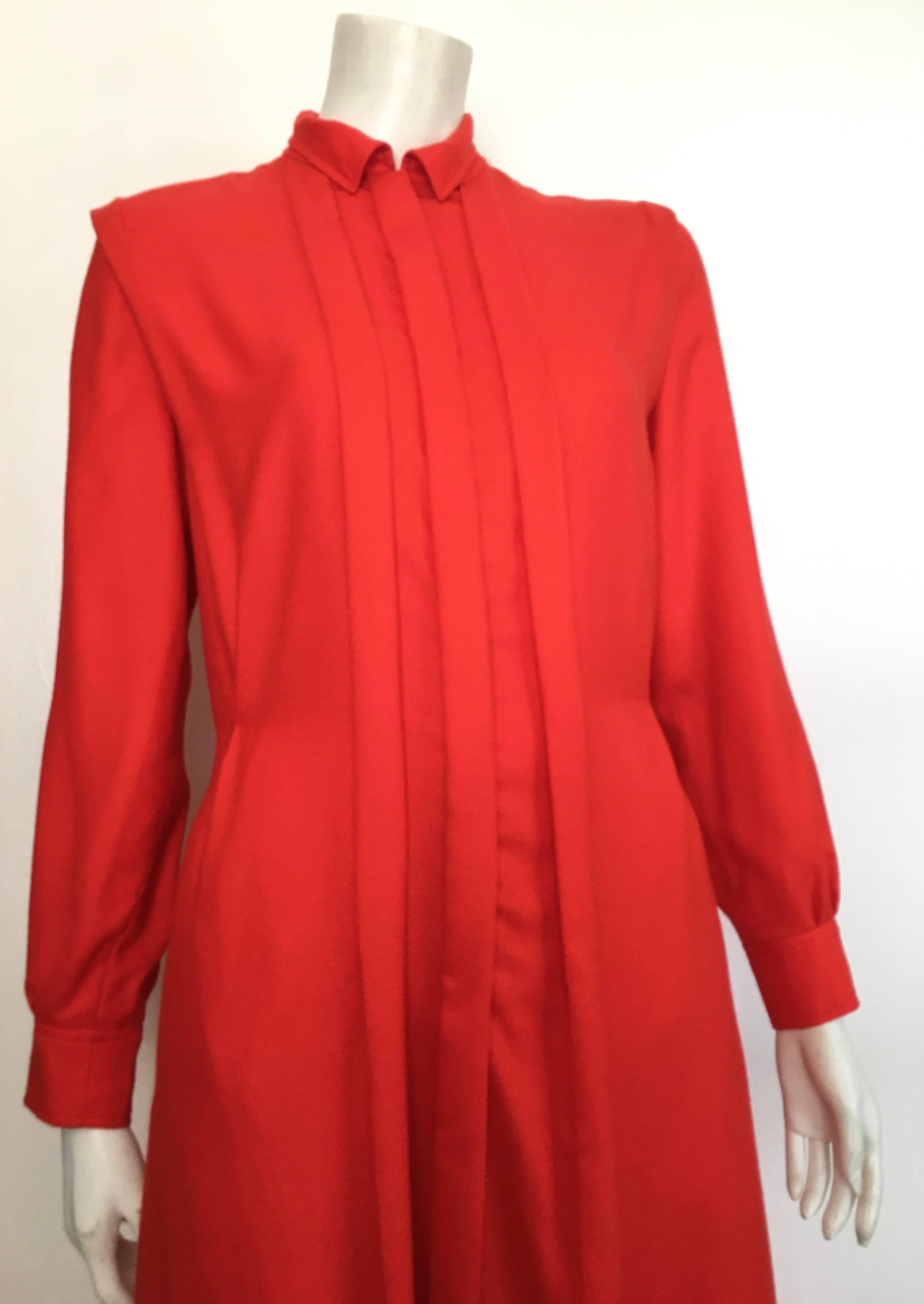 Courreges Paris 1980s fire engine red wool long sleeve dress with pockets is a size 8. The waist on this dress is 32
