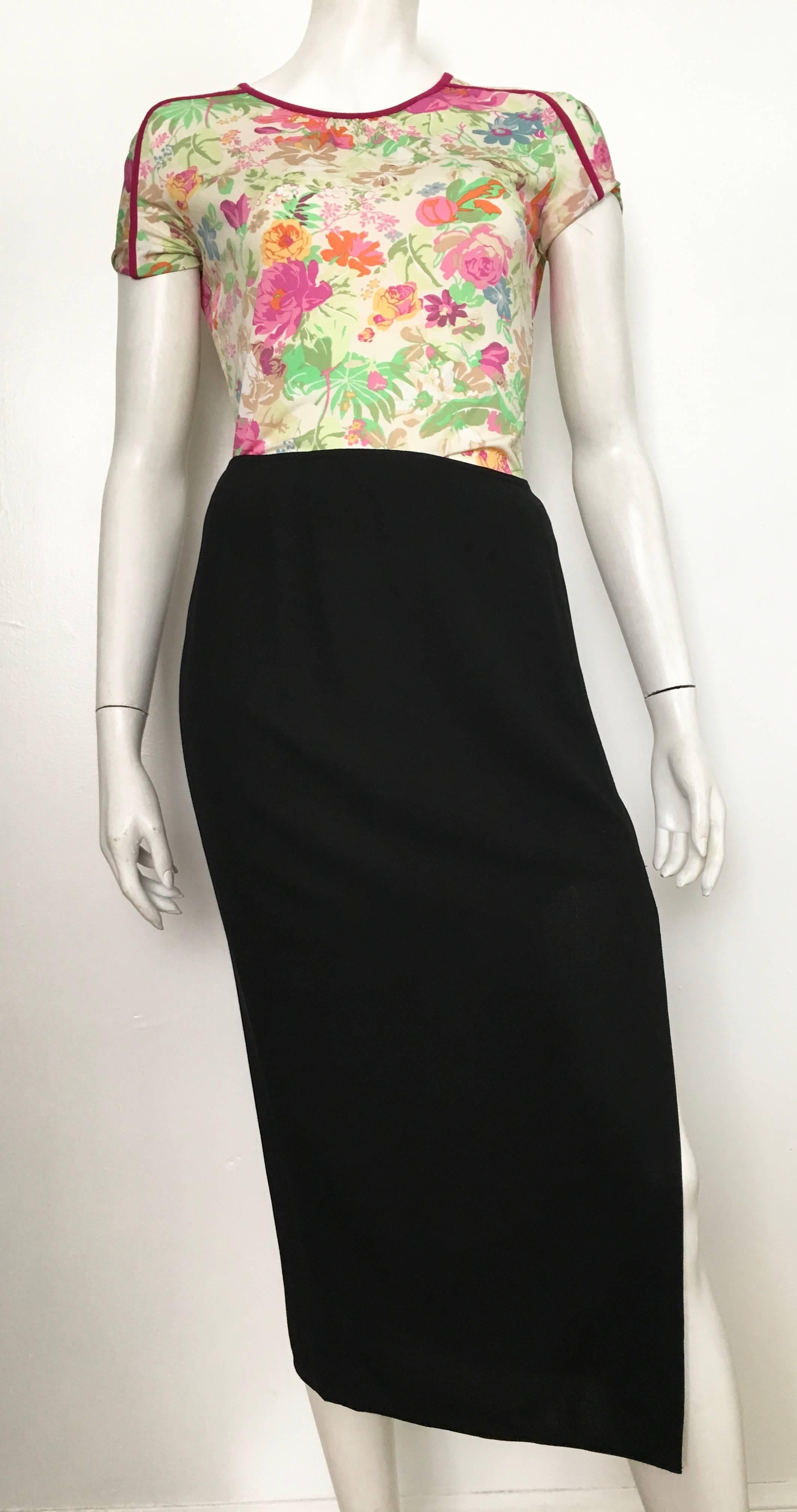Donna Karan 1990s long black wool with sexy slit skirt, made in Italy, is a size 6. The waist on this skirt is 31