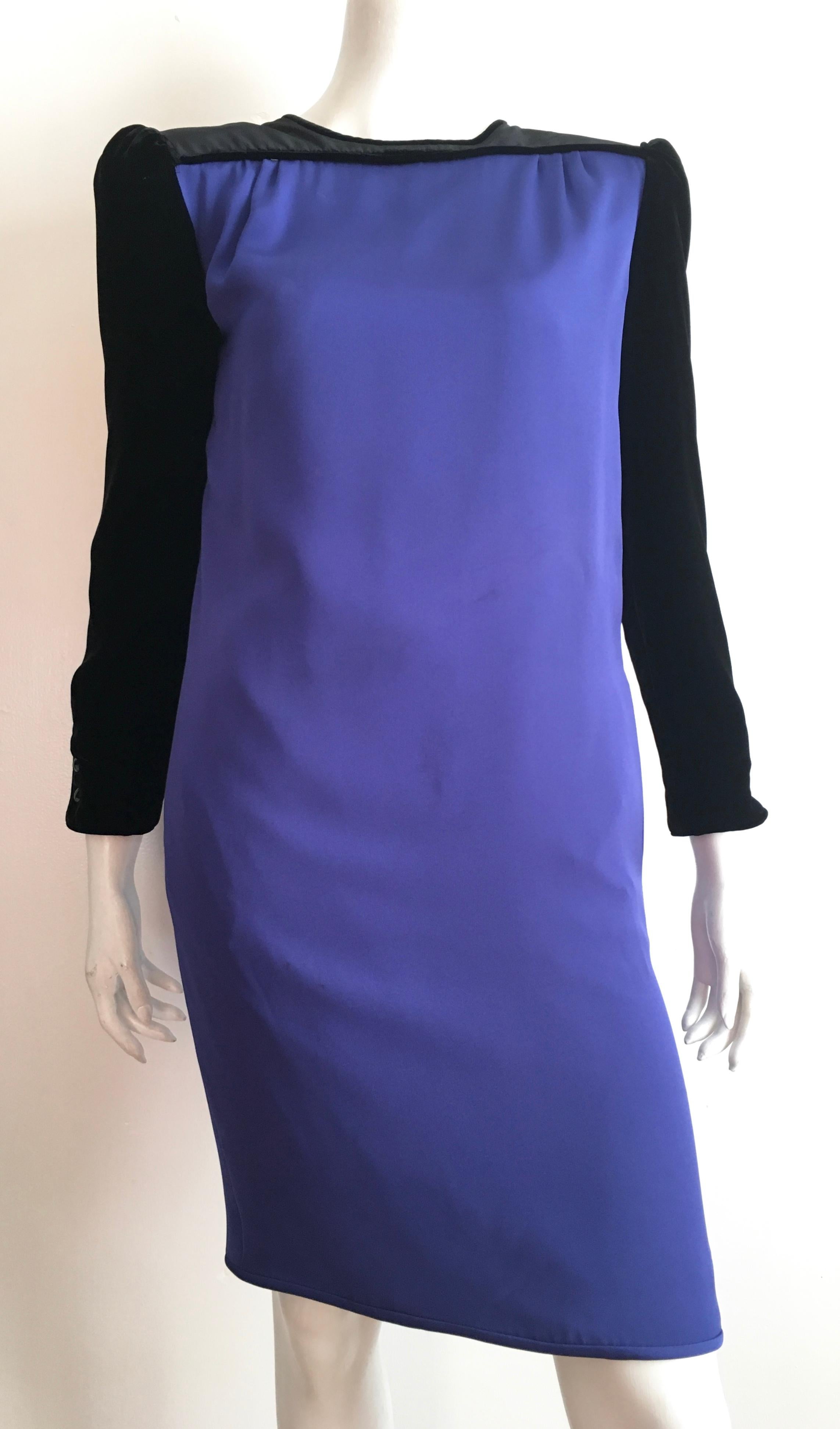 Night by Valentino 1980s blue / purple silk with black velvet sleeves & neckline dress with pockets is a size 4.  This dress is the perfect example of just how masterful Valentino has always been, the craftsmanship is superior.  Dress is fully lined