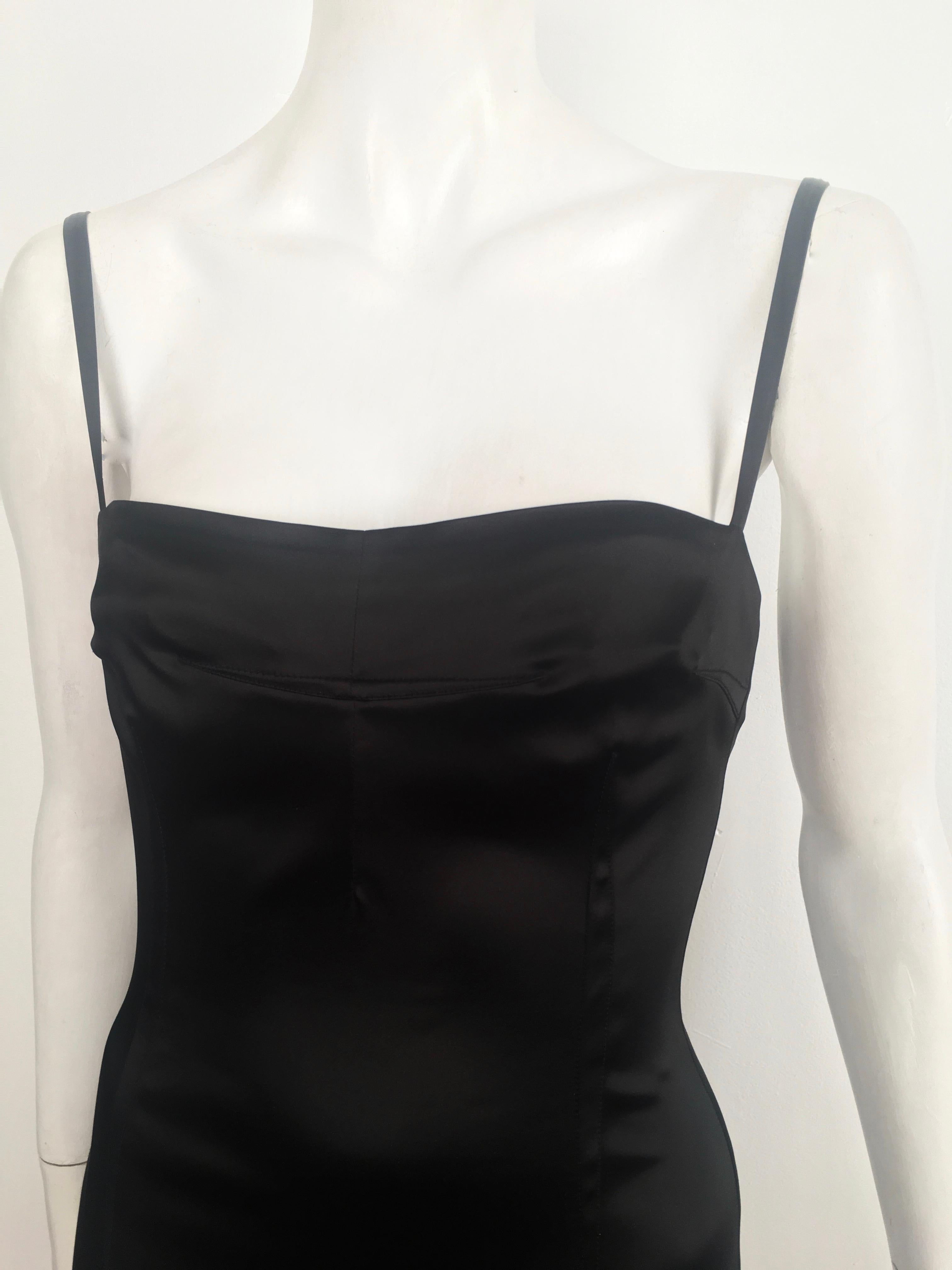 Dolce & Gabbana 1990s black stretchy sexy cocktail evening dress is an Italian size 44 and an USA size 4.  This fits Matilda the Mannequin, who wears size 4, to perfection... so if you have the identical body structure as Matilda this would be for
