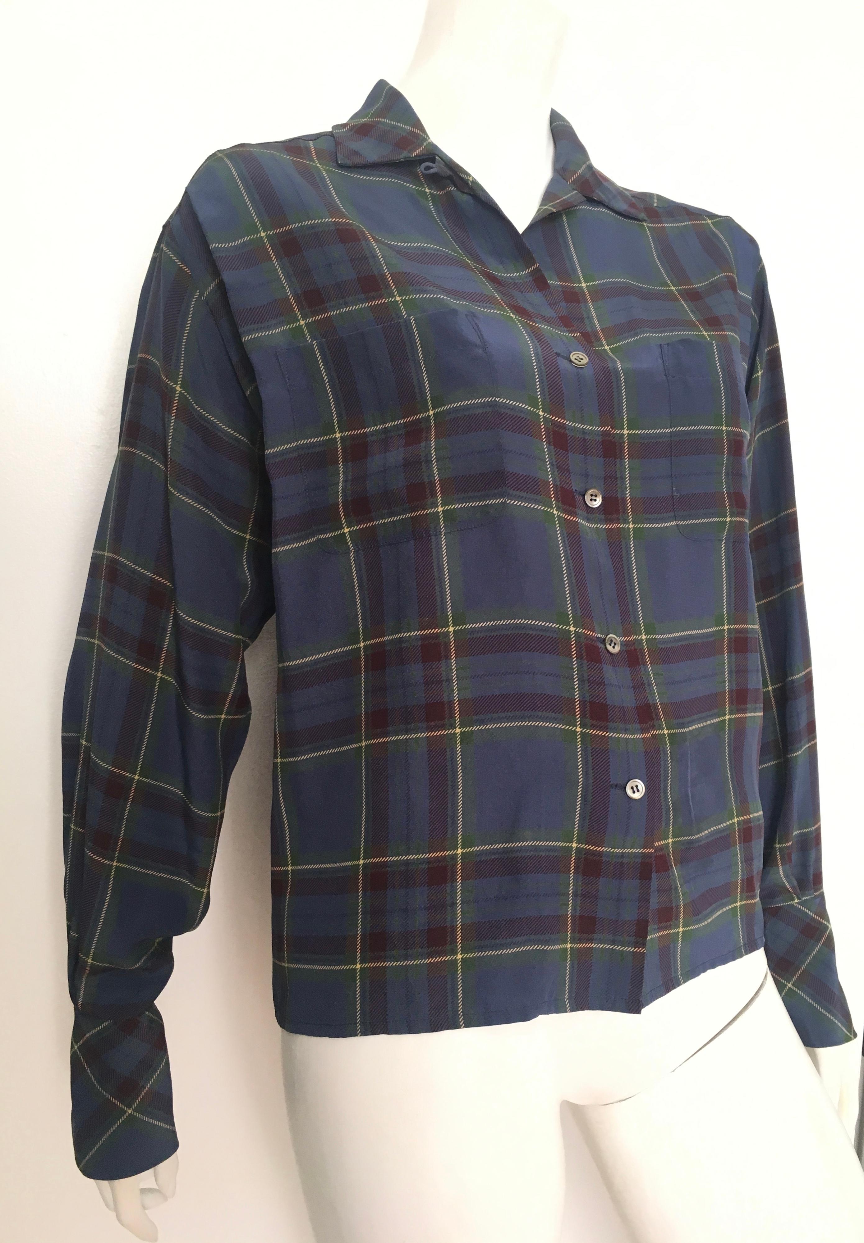 Calvin Klein 1980s silk plaid long sleeve blouse is a size 6.  This blouse was designed when Calvin Klein was at the helm of his fashion brand. Gorgeous cuffs that can be worn folded up or worn folded down. Ladies here is your opportunity to own a