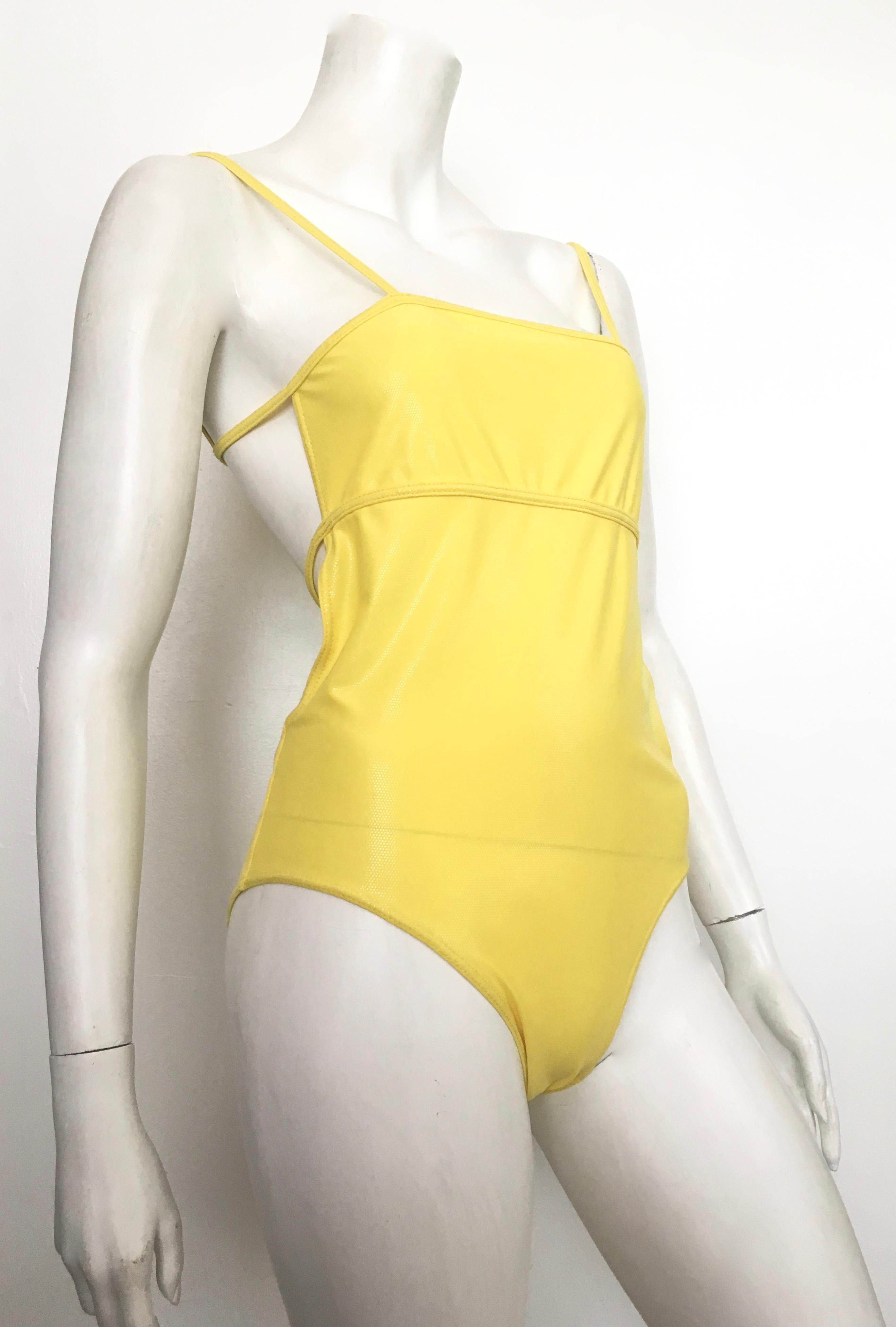 Herve Leger yellow swimsuit is a French size 40 and fits a size 8.  This stunning design will have everyone's eyes on you while walking the beaches of Cabo, Majorca, St.Tropez or the Red Neck Rivera of the Alabama coastline. This is a size 8 so it