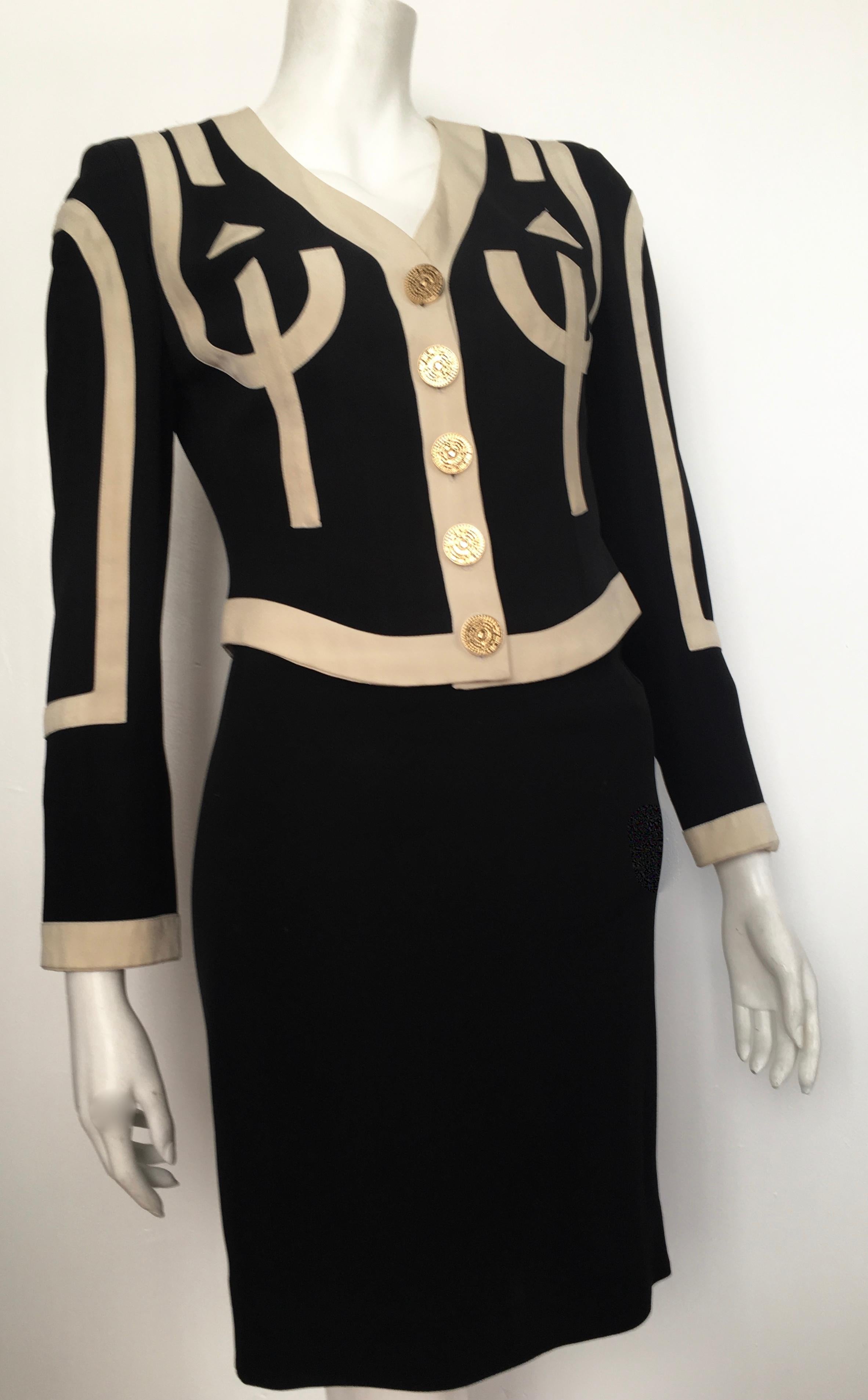Moschino Cheap & Chic 1990s black & cream jacket & skirt suit made in Italy. The jacket is a labeled a size 6 and the skirt is labeled size 4.  The waist on the skirt is 24. 1/2