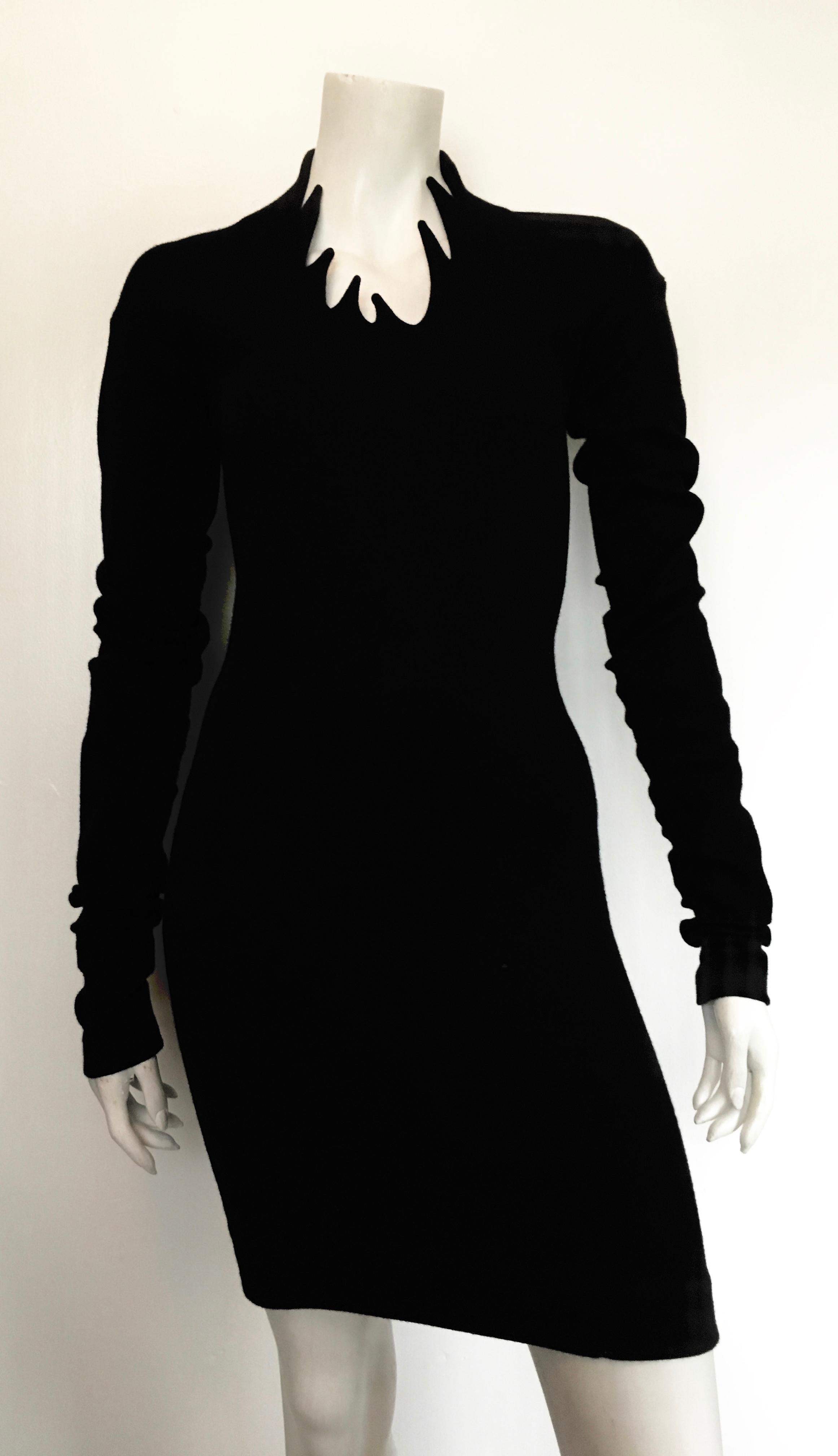 Romeo Gigli 1990 black wool long sleeve sexy dress with dramatic collar is an Italian size 40 and an US size 4.  This striking spectacular dress is jaw dropping. Sleeves can be tucked or rolled but I like the dramatic effect of just letting them