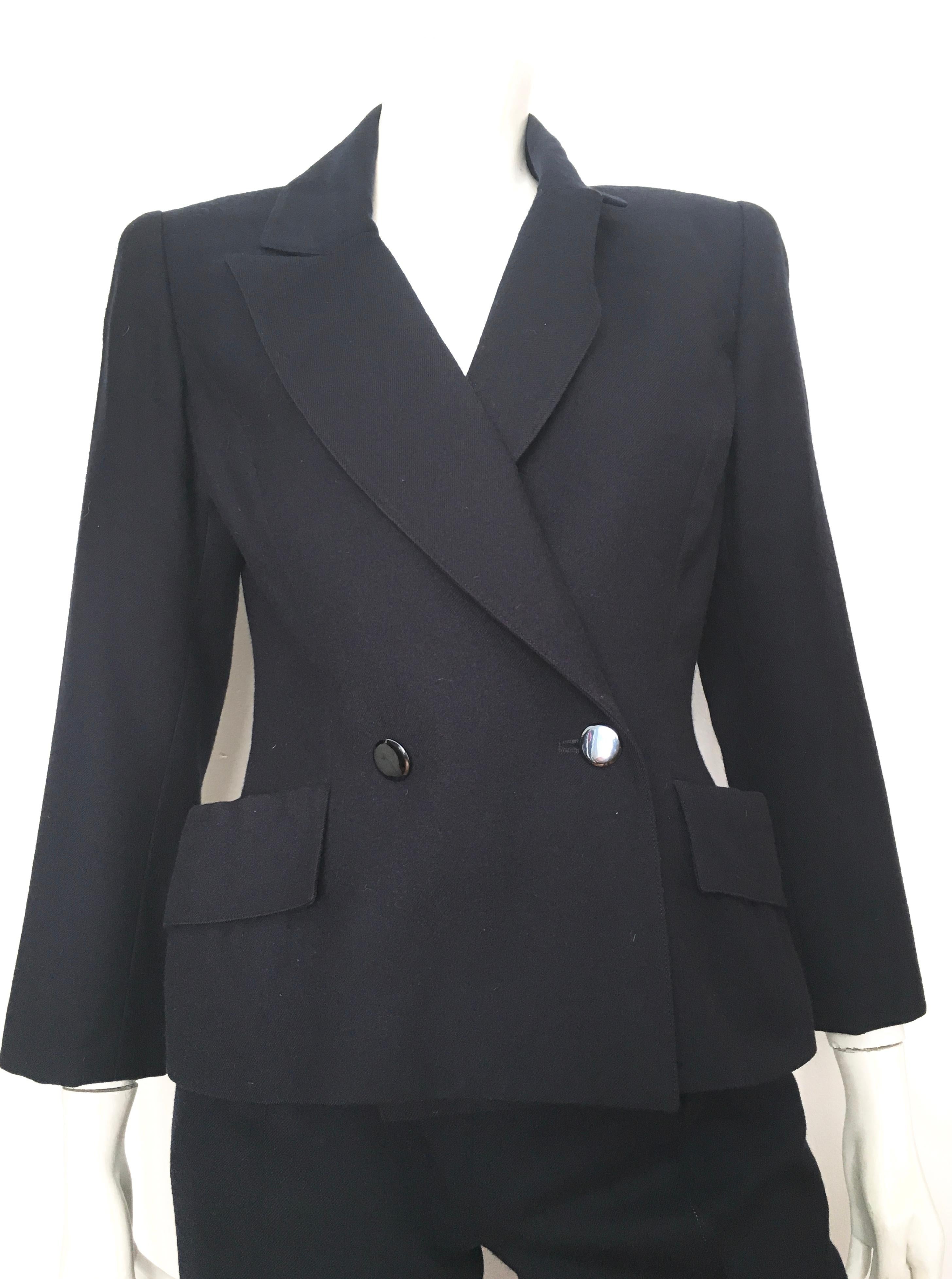 Chloe 1980s navy wool pant suit is a size 4.  The waist on these pants are 25. 1/2