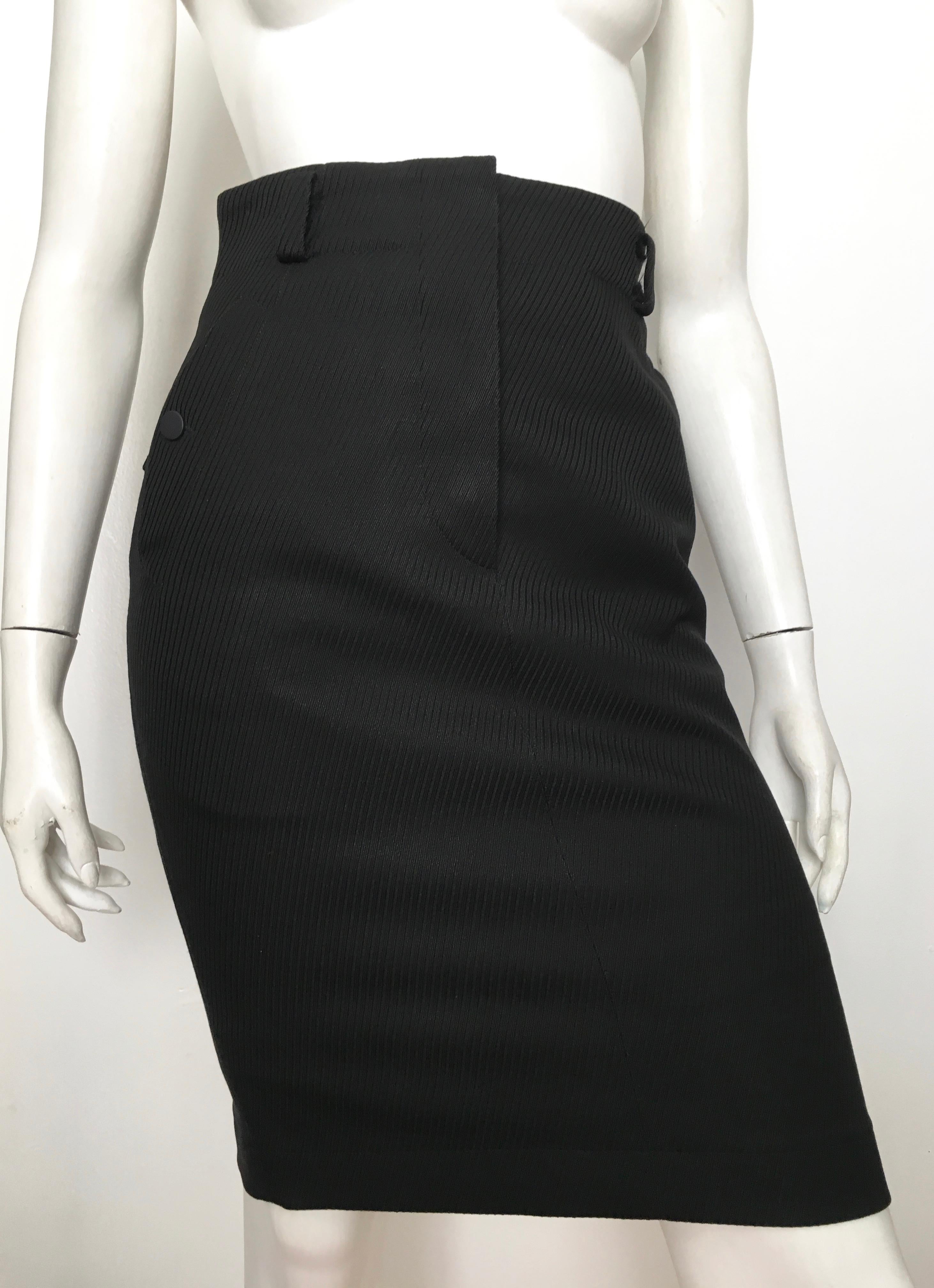 Azzedine Alaia 1980s black pencil skirt with pockets is labeled a size 6 but fits more like an US size 4.  The waist on this skirt is 28