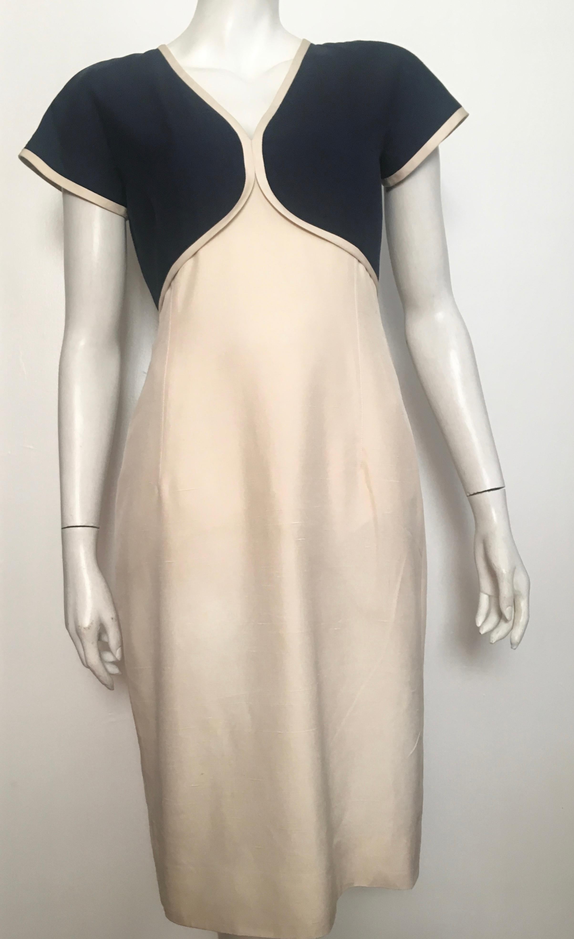 Valentino Boutique 1980s silk short sleeve navy & cream dress is labeled a size 8 but fits more like a size 6.  The waist on this dress is 29