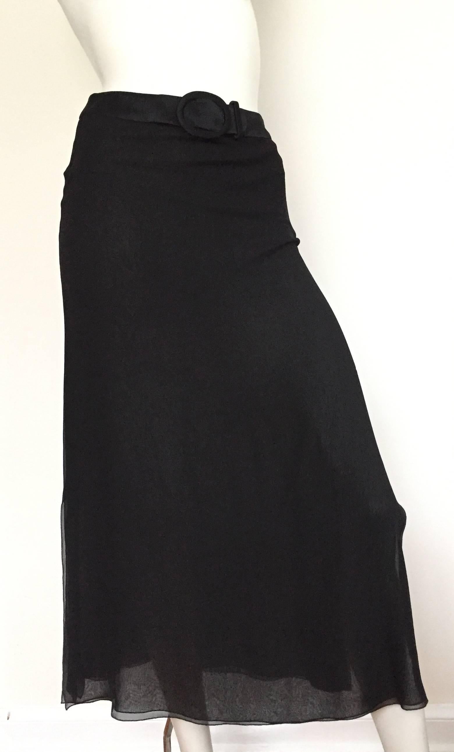 Valentino Boutique 1980s long black silk skirt size 6.  Please see & use measurements so that you can properly measure your lovely body. There are two flowing layers of silk with sexy slits on both sides of skirt. This is a stunning long elegant