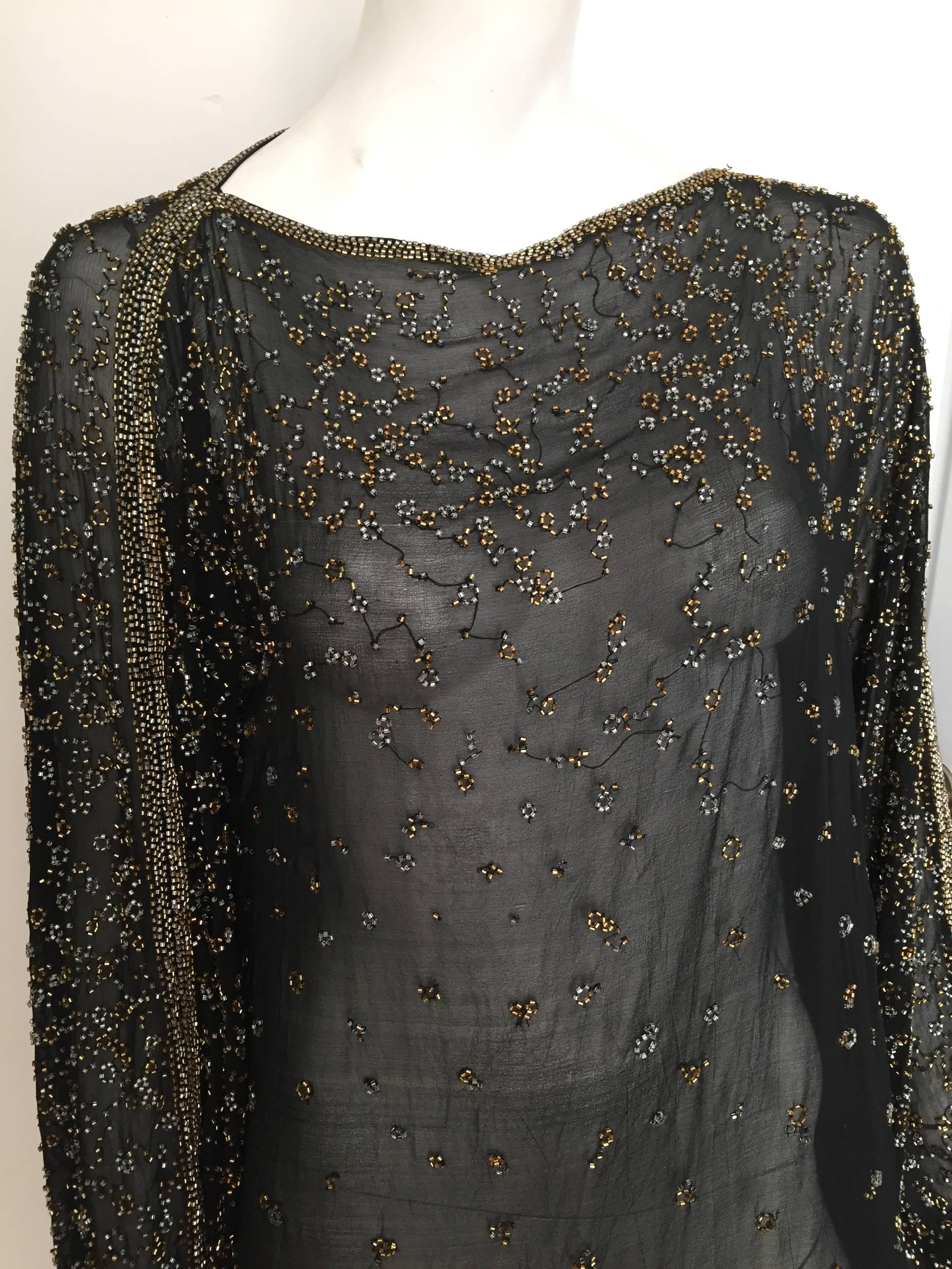Halston 1970s black silk beaded sheer dress is a size large and will fit size 8 / 10 but please see & use measurements below so you can properly measure your body to make sure this will fit you the way Halston would be proud of. Wear a sexy black