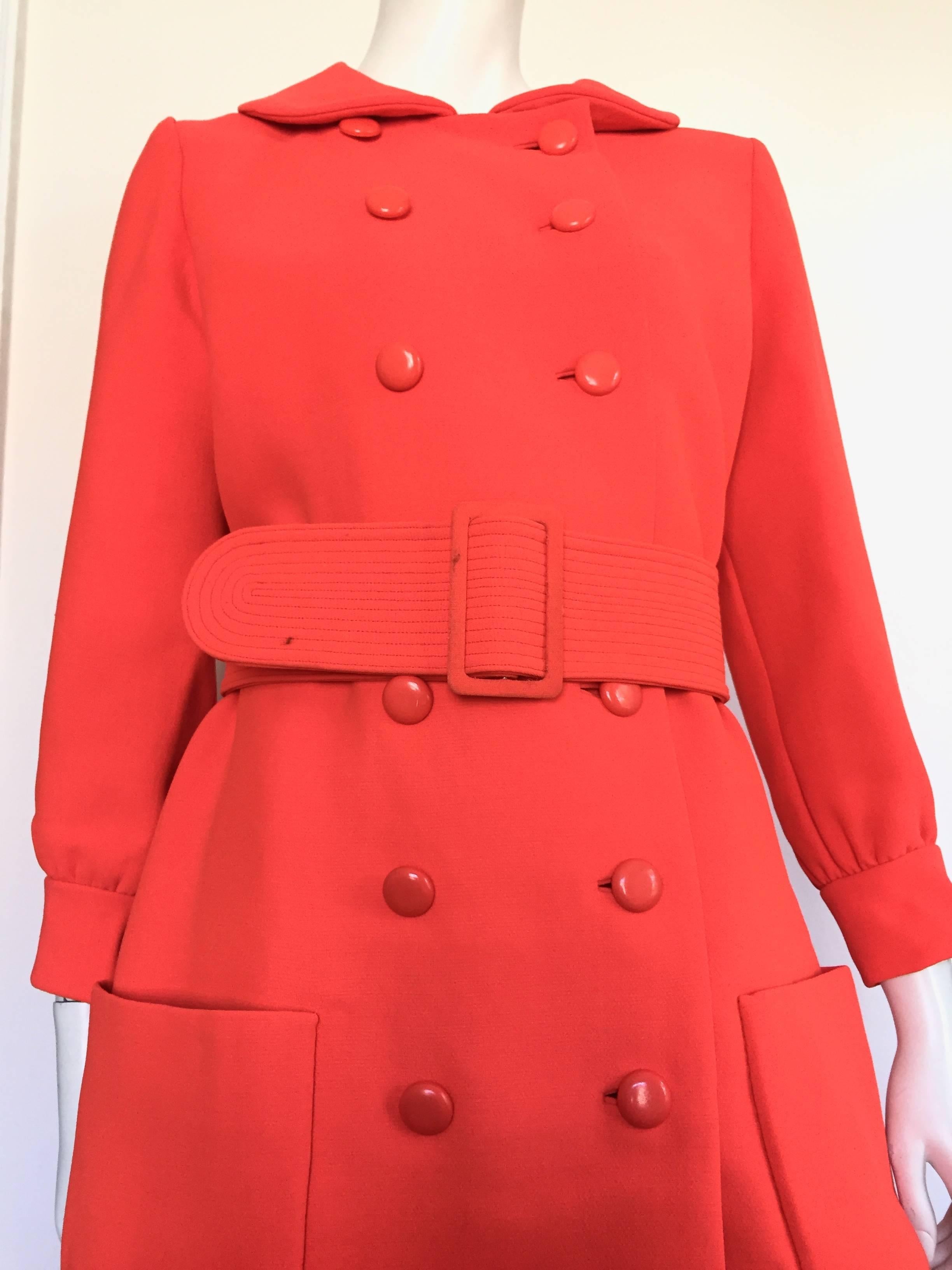 Norman Norell 1960s red orange wool stylish coat with front pockets and matching belt was made for Rich's Department Store in Atlanta. This coat will fit a size 6 / 8 but please see & use the measurements below so that you can measure your body and