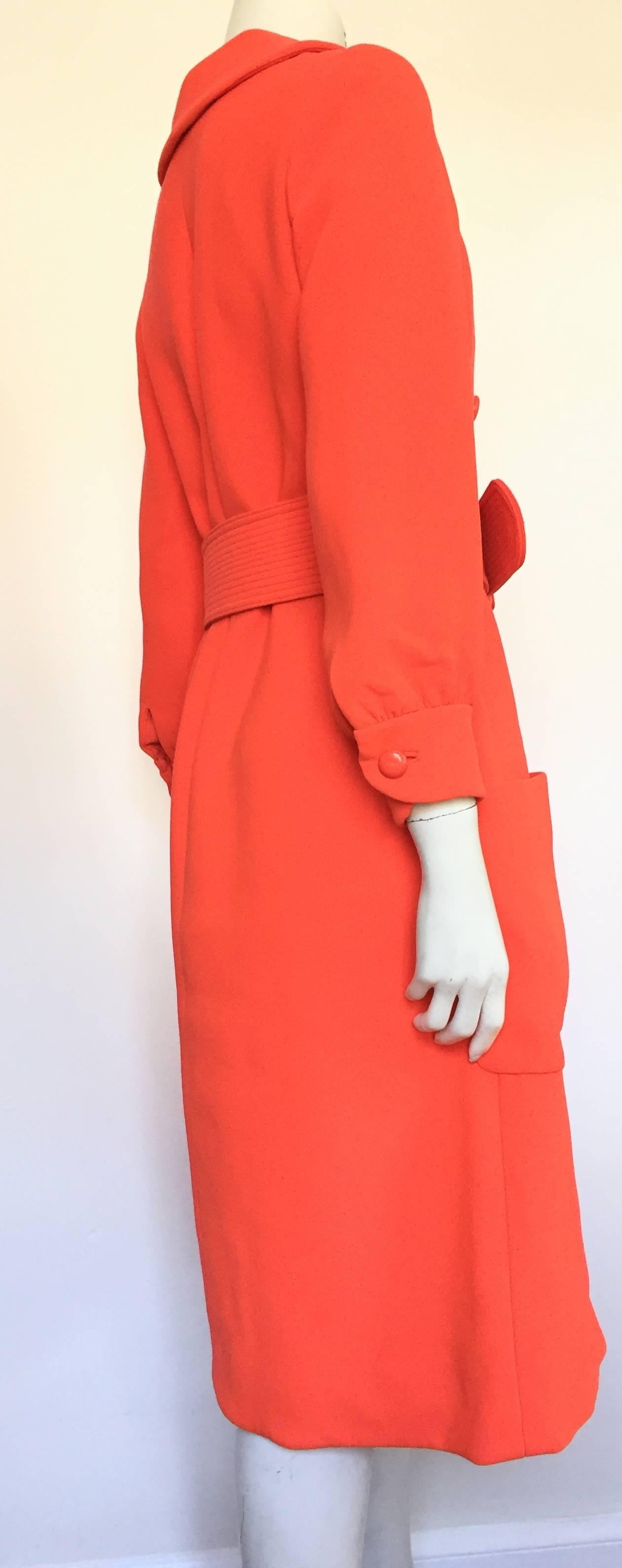 Norman Norell 60s orange wool coat with belt size 6 / 8. For Sale 1