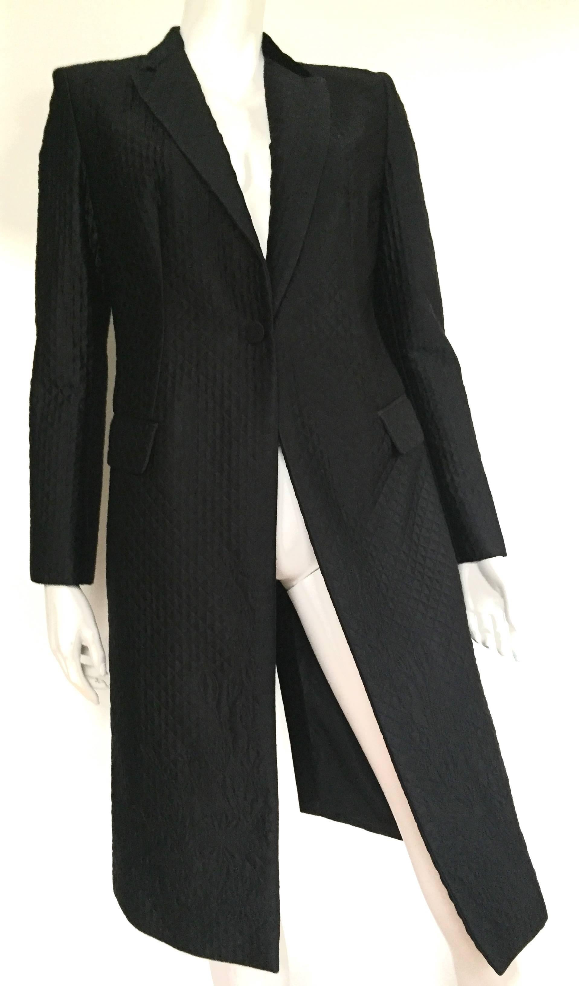 Alexander McQueen 2005 long black quilted silk coat is an Italian size 44 and fits a USA size 8 ( Please see & use the measurements below so that you can properly measure your waist to make sure this will fit you to perfection and the way Alexander