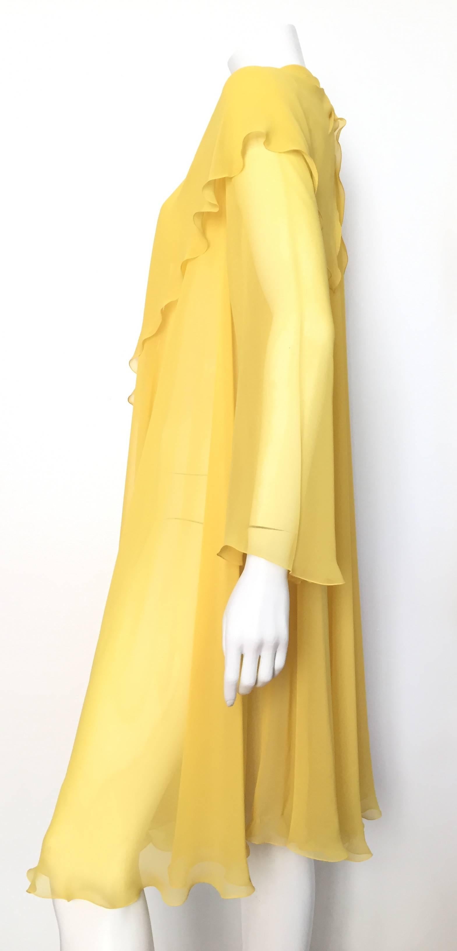 Loris Azzaro 1980s canary yellow silk sheer lightweight jacket is a size 2 but fits this size 4 mannequin nicely. This gorgeous canary yellow lightweight jacket is perfect to wear with your LBD, jumpsuit, bathing suit, blouse & jeans or just