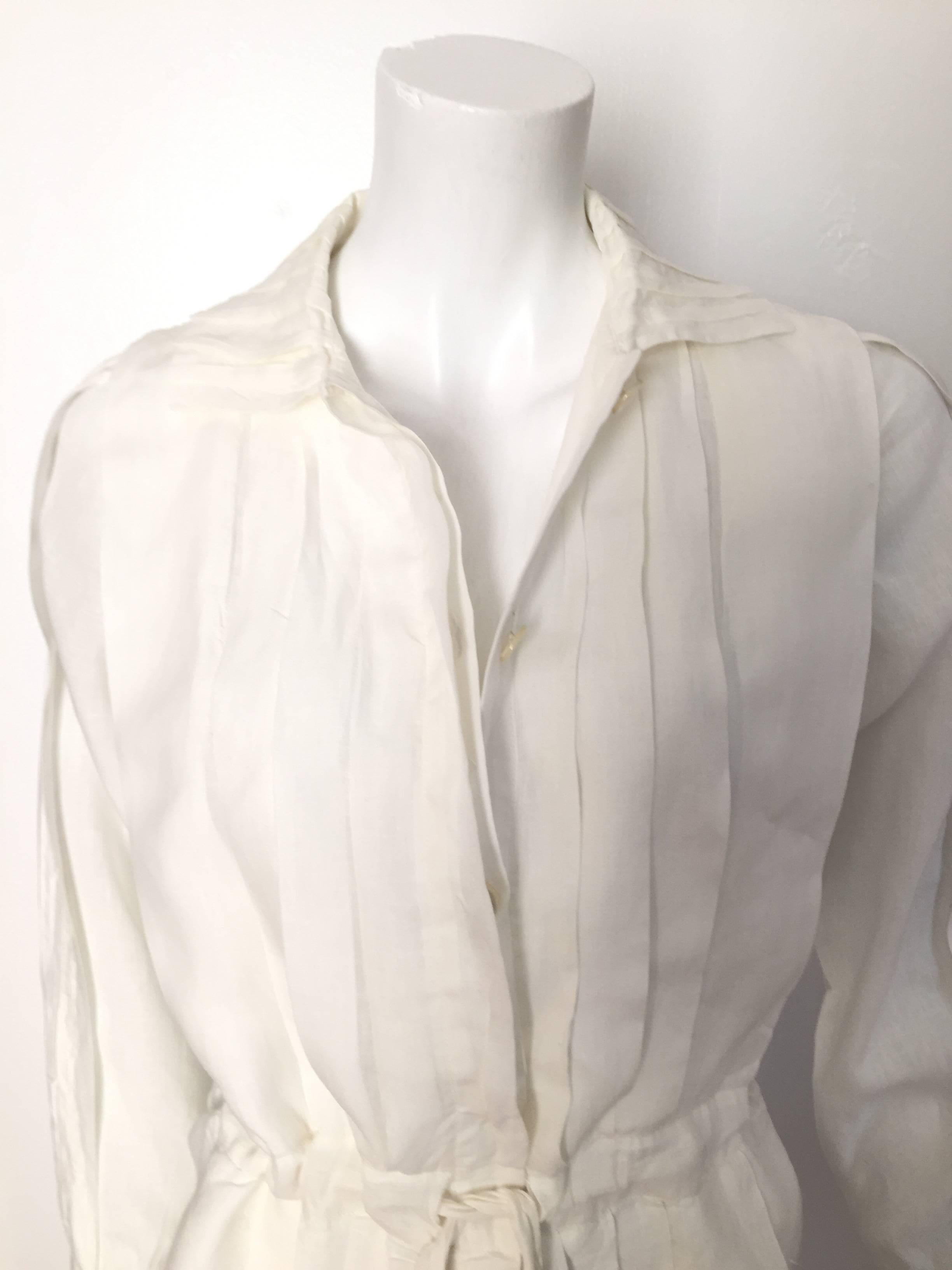 Laura Biagiotti for Bonwit Teller 1980s white linen pleated button up dress with draw string at waistline is an Italian size 40 and fits like a modern USA size 4 / 6 but please see & use the measurements below so you can properly measure your body.