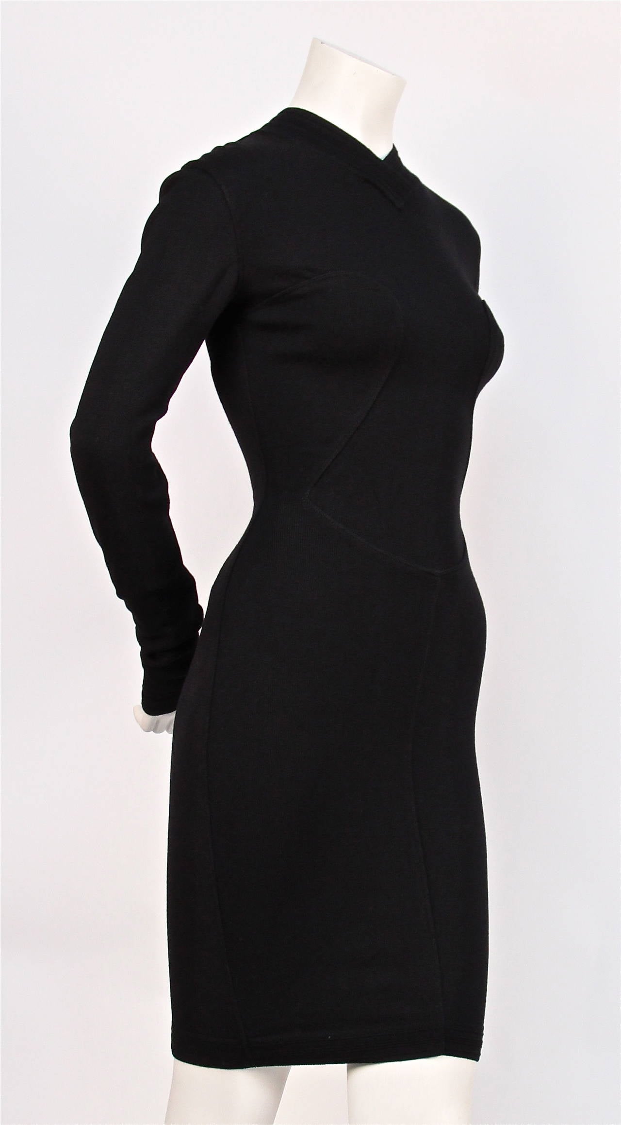 Jet black knit dress with sweetheart seams from Azzedine Alaia dating to the 1990's. Dress is labeled a size 'XS' however it would easily fit a size 'S' as well. Approximate unstretched measurements: 16